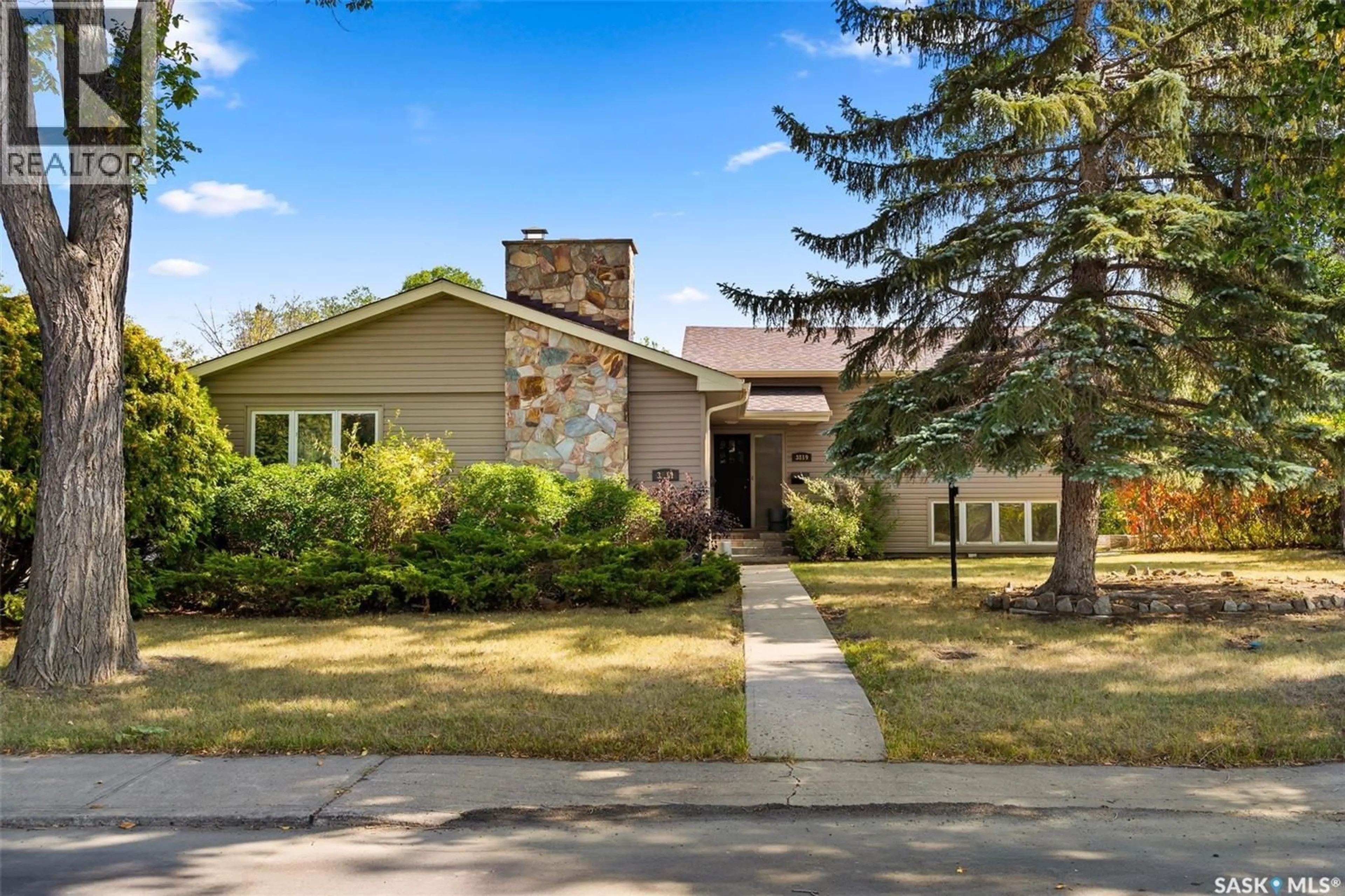 Home with brick exterior material, street for 3811-3819 GARNET STREET, Regina Saskatchewan S4S2K5