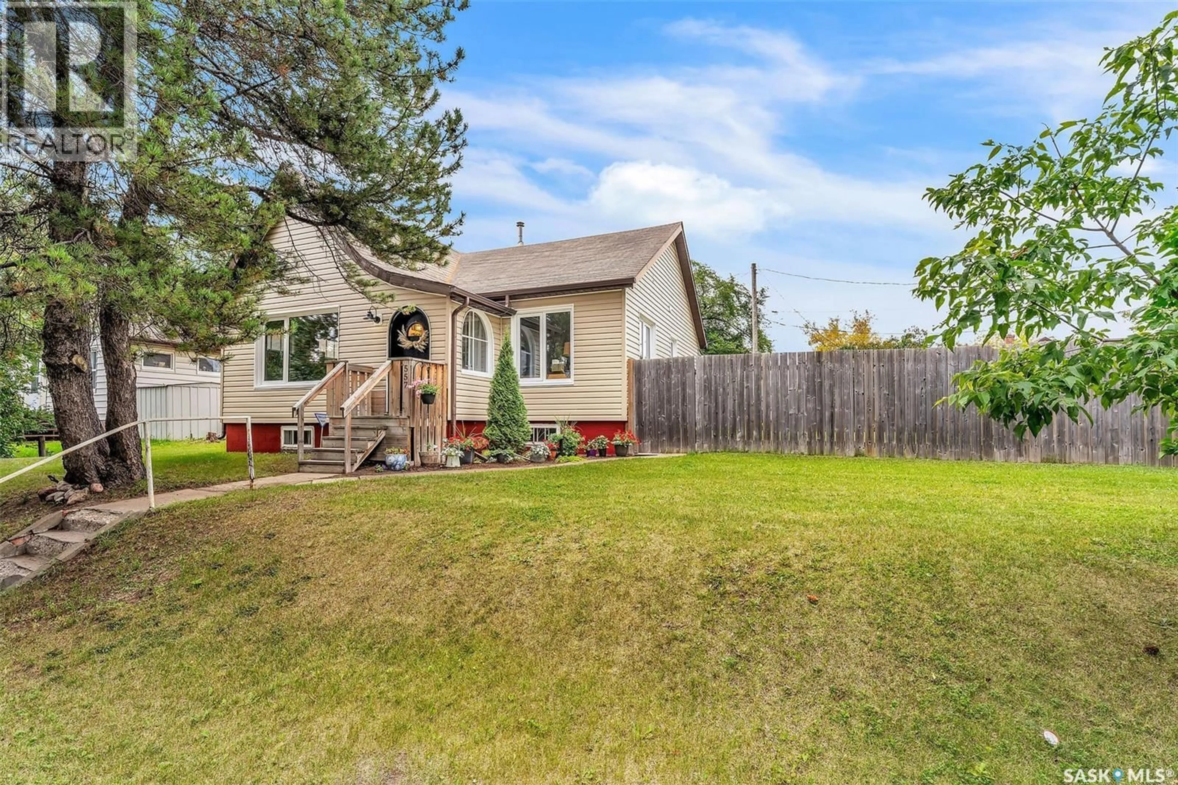 Home with vinyl exterior material, street for 557 13TH STREET, Prince Albert Saskatchewan S6V3G8