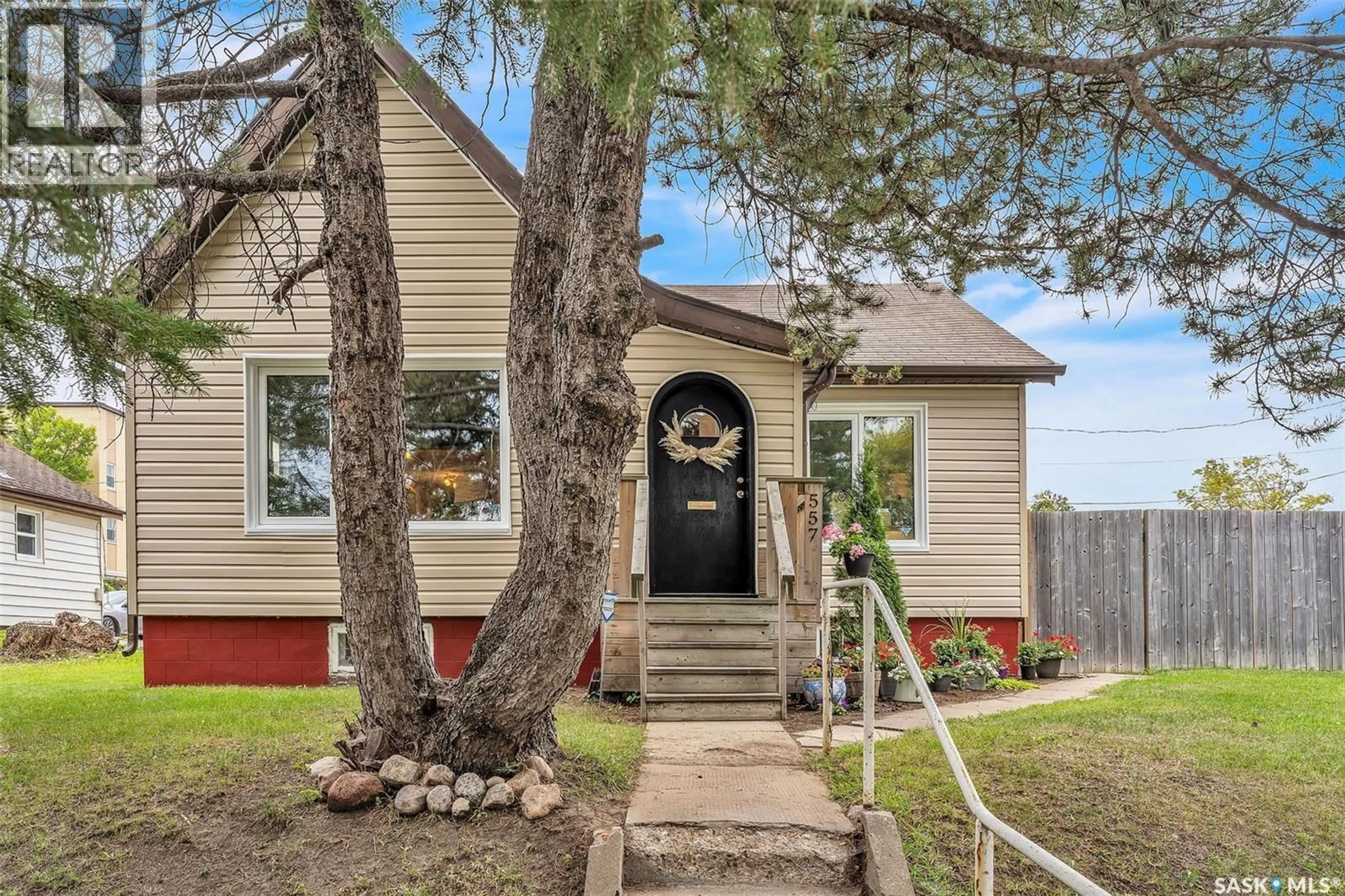 Home with vinyl exterior material, street for 557 13TH STREET, Prince Albert Saskatchewan S6V3G8