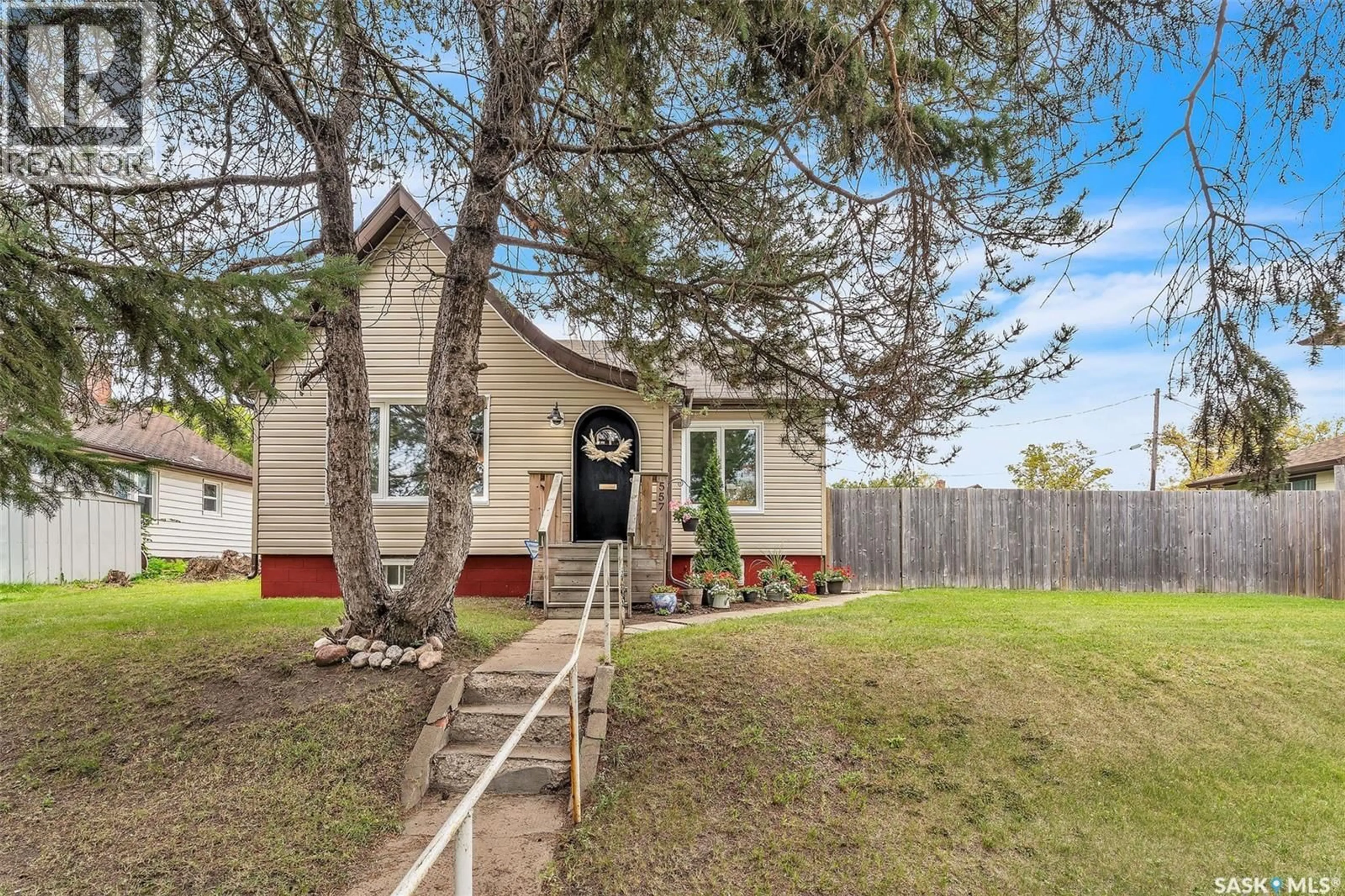 Home with vinyl exterior material, street for 557 13TH STREET, Prince Albert Saskatchewan S6V3G8