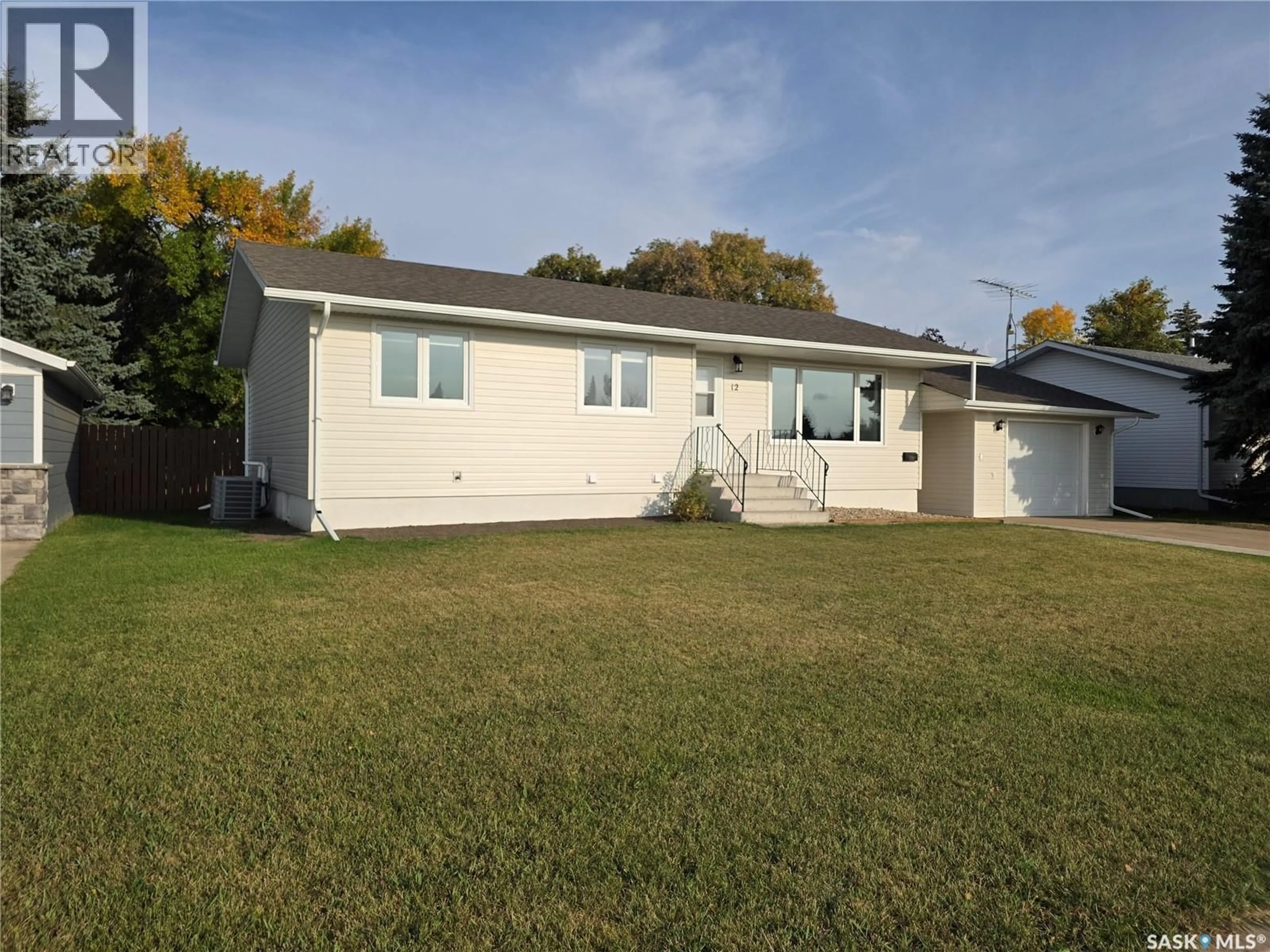 Home with vinyl exterior material, street for 12 TUFTS CRESCENT, Outlook Saskatchewan S0L2N0