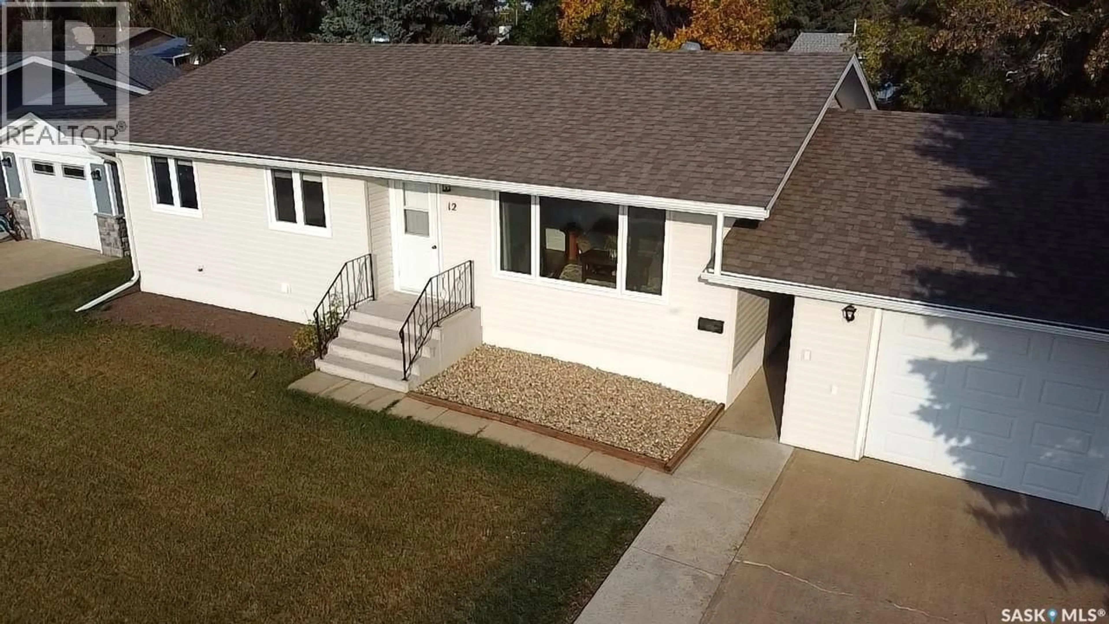A pic from outside/outdoor area/front of a property/back of a property/a pic from drone, street for 12 TUFTS CRESCENT, Outlook Saskatchewan S0L2N0