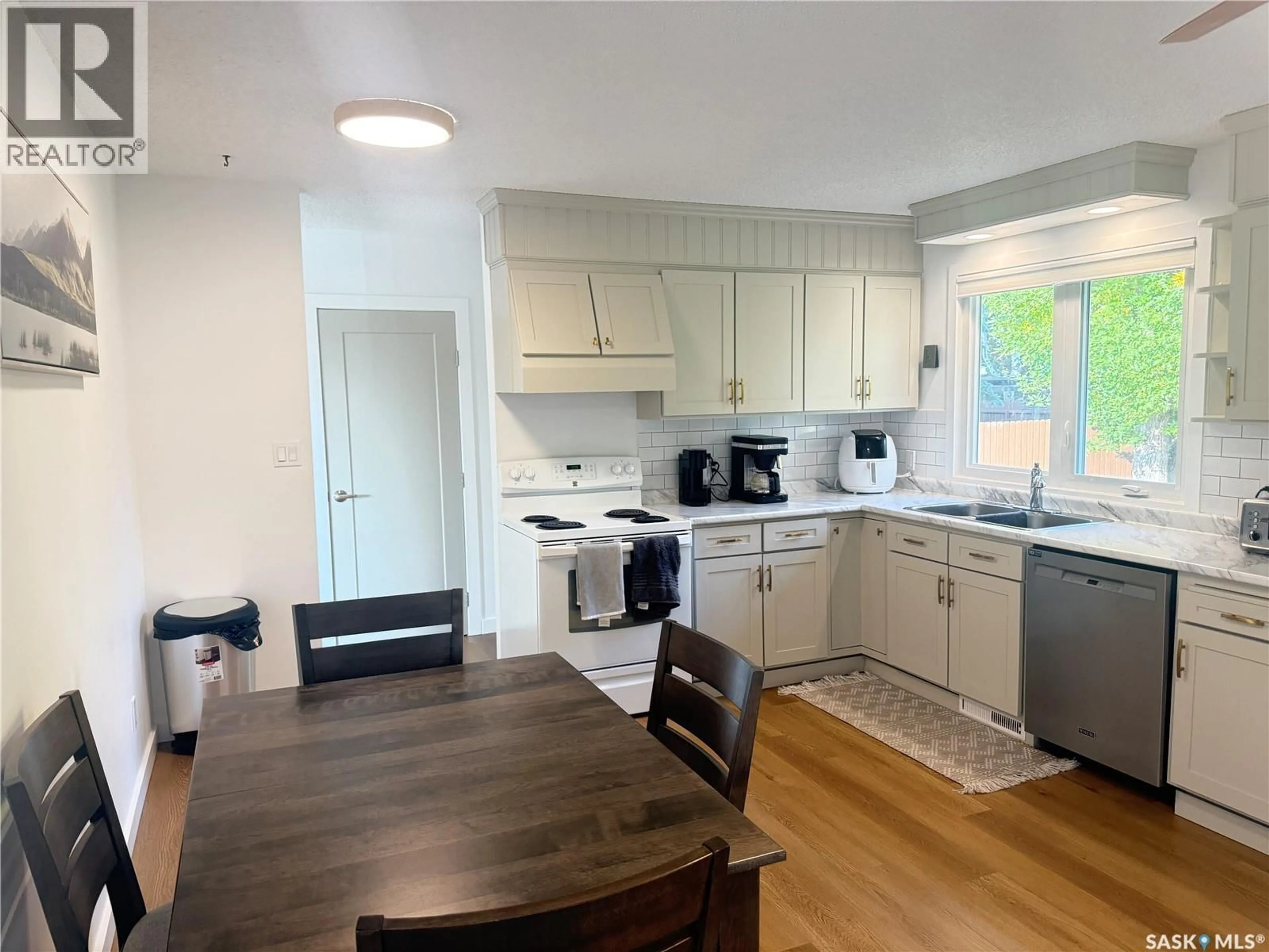 Open concept kitchen, wood/laminate floor for 12 TUFTS CRESCENT, Outlook Saskatchewan S0L2N0