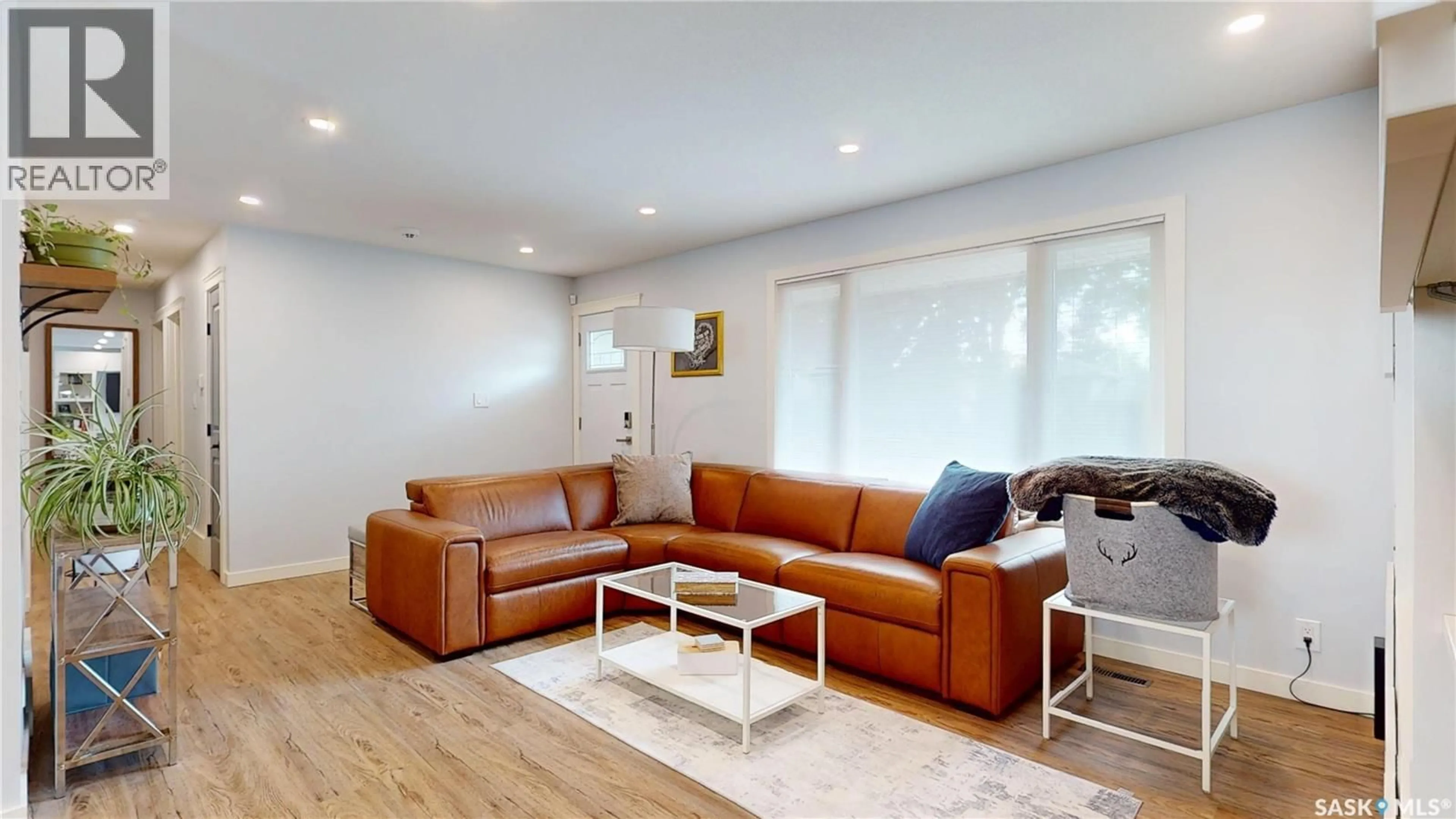 Living room with furniture, wood/laminate floor for 158 LITZENBERGER CRESCENT, Regina Saskatchewan S4R5X9