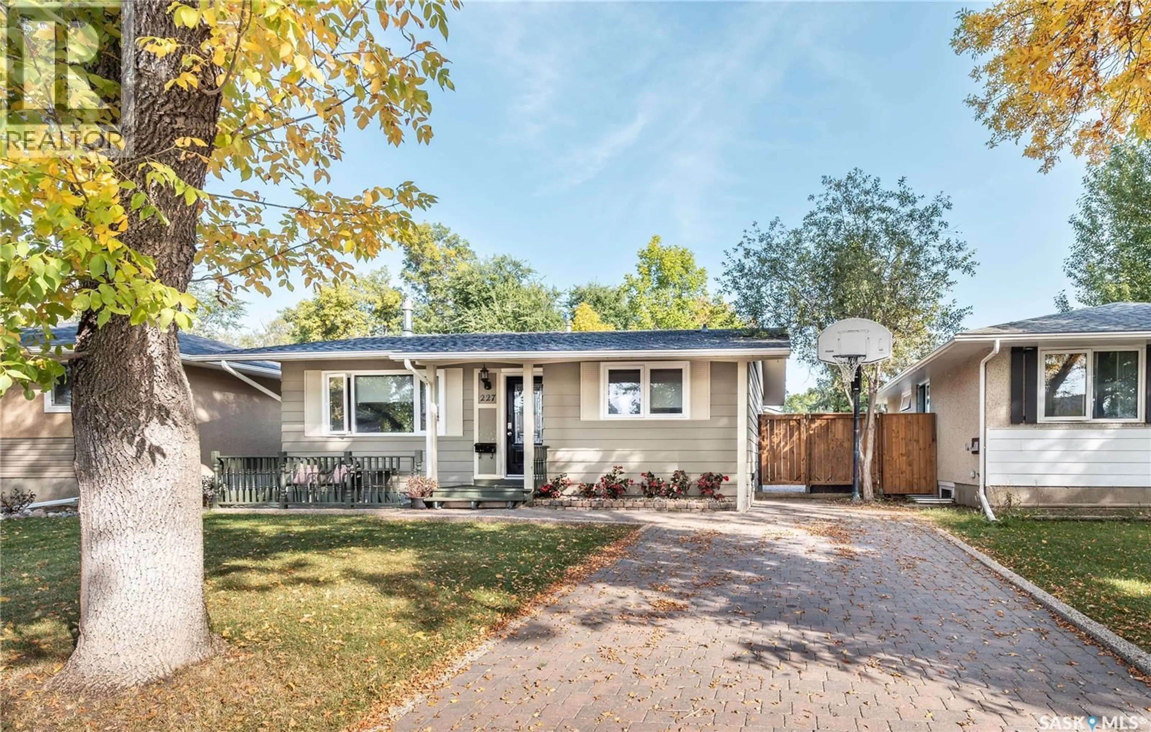 Home with vinyl exterior material, street for 227 MCMASTER CRESCENT, Saskatoon Saskatchewan S7H4E4