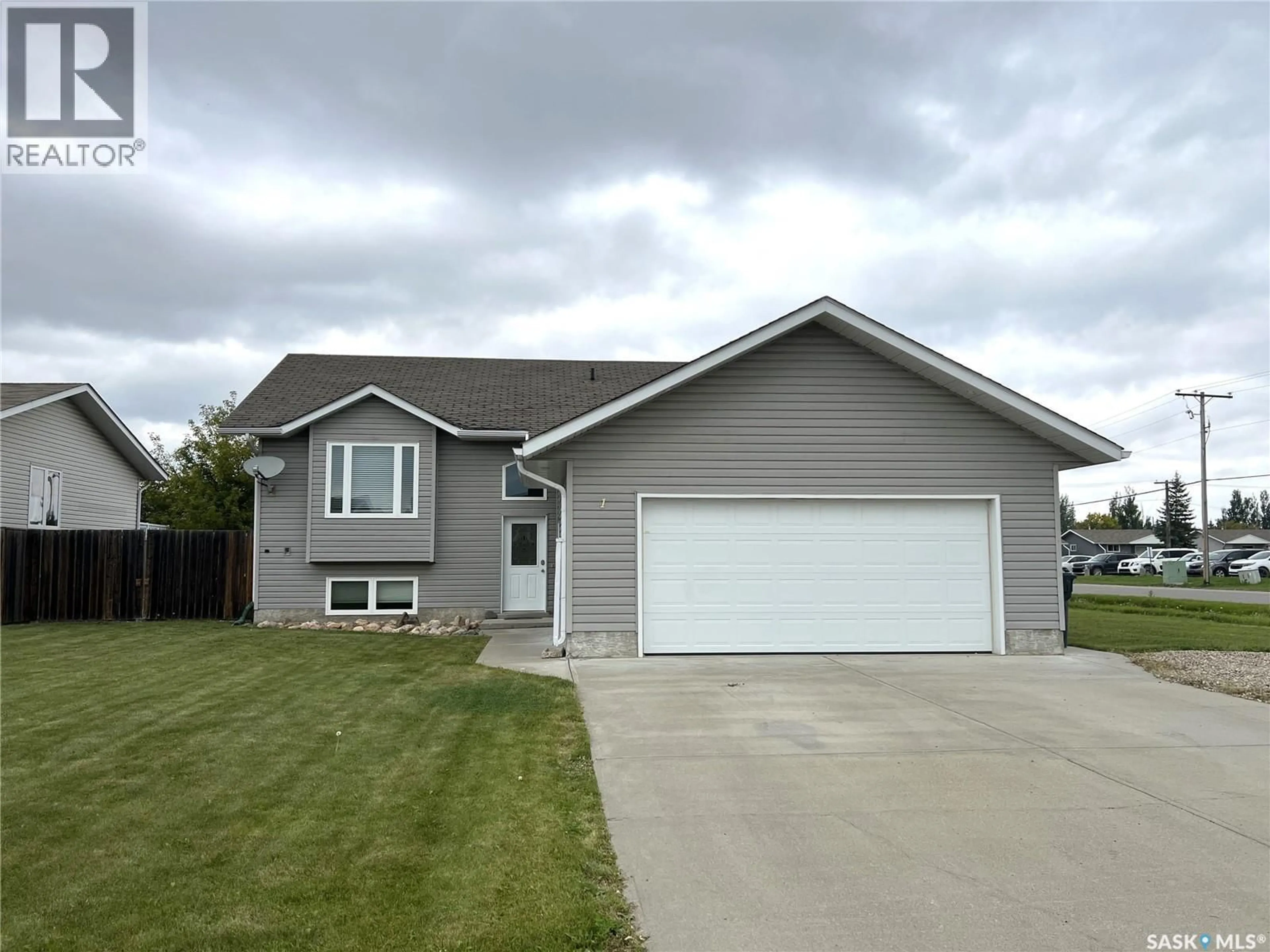Home with vinyl exterior material, street for 1 JACKSON DRIVE, Meadow Lake Saskatchewan S9X1T9