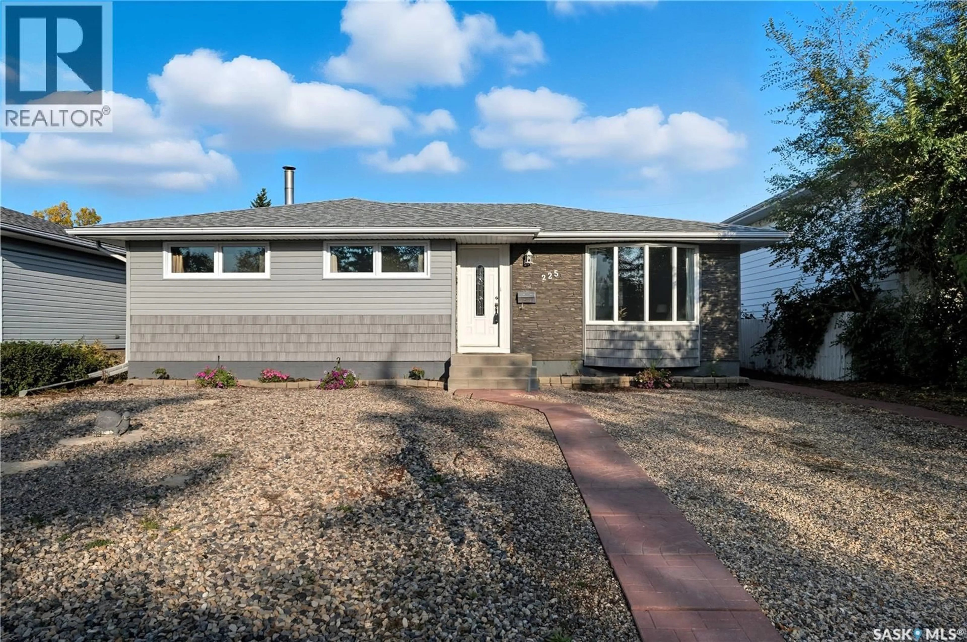 Home with vinyl exterior material, street for 225 WASCANA STREET, Regina Saskatchewan S4R4H8