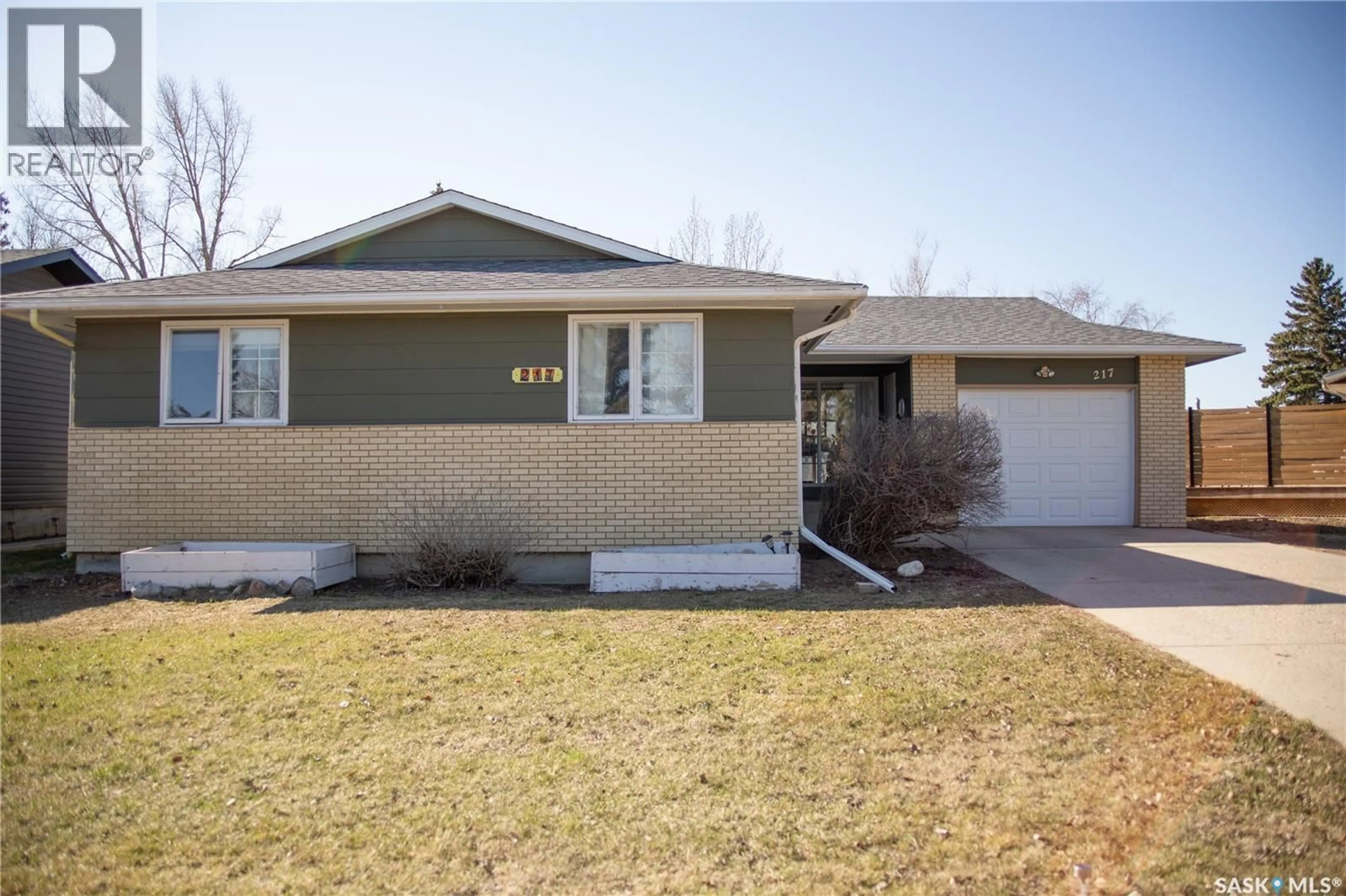 Home with vinyl exterior material, street for 217 10TH AVENUE, Kindersley Saskatchewan S0L1S0