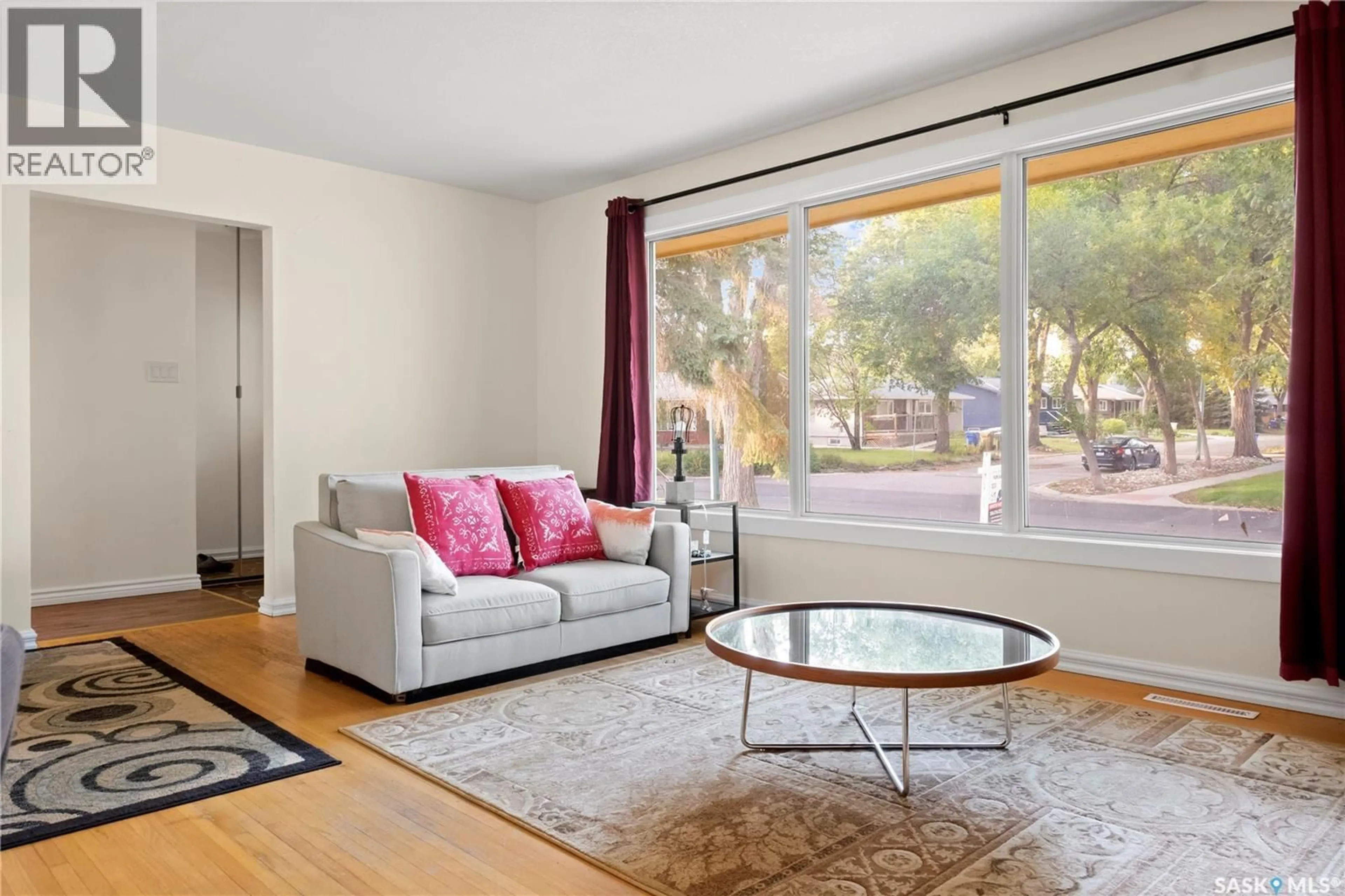 Living room with furniture, wood/laminate floor for 94 DUNNING CRESCENT, Regina Saskatchewan S4S3W1
