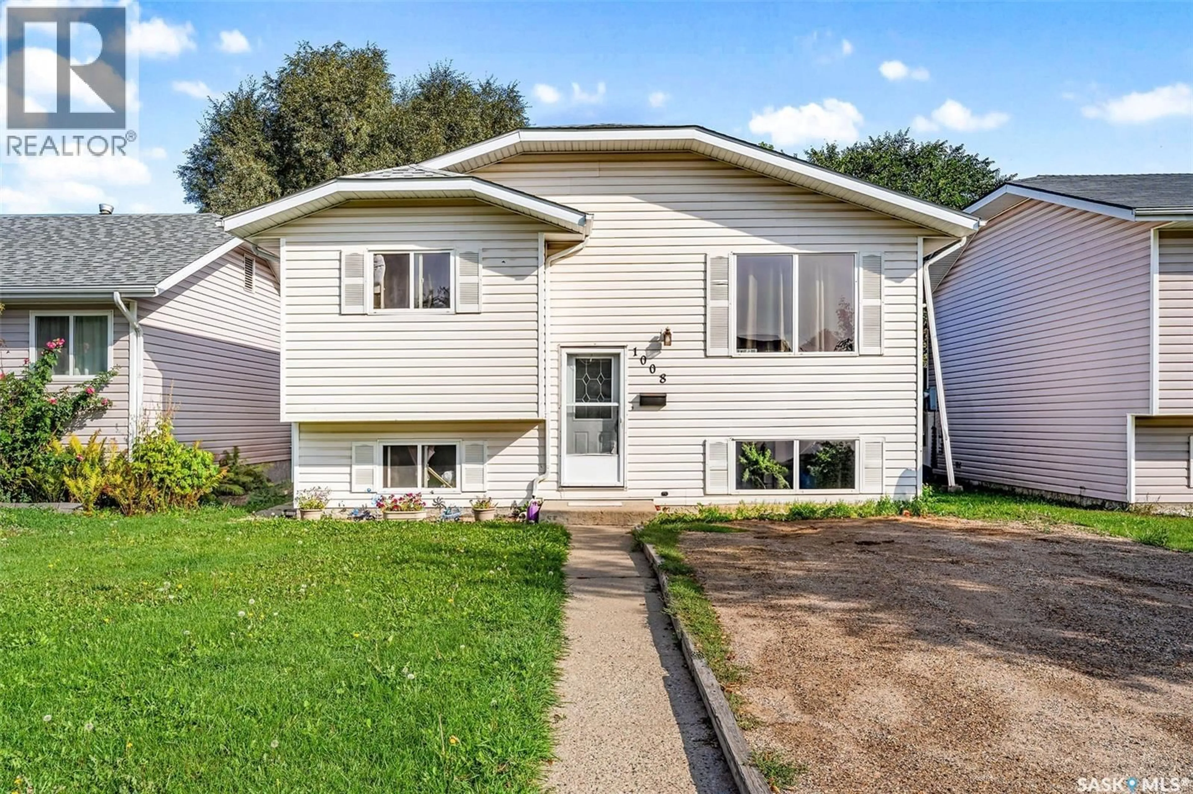 Home with vinyl exterior material, street for 1008 2ND STREET, Prince Albert Saskatchewan S6V0P8