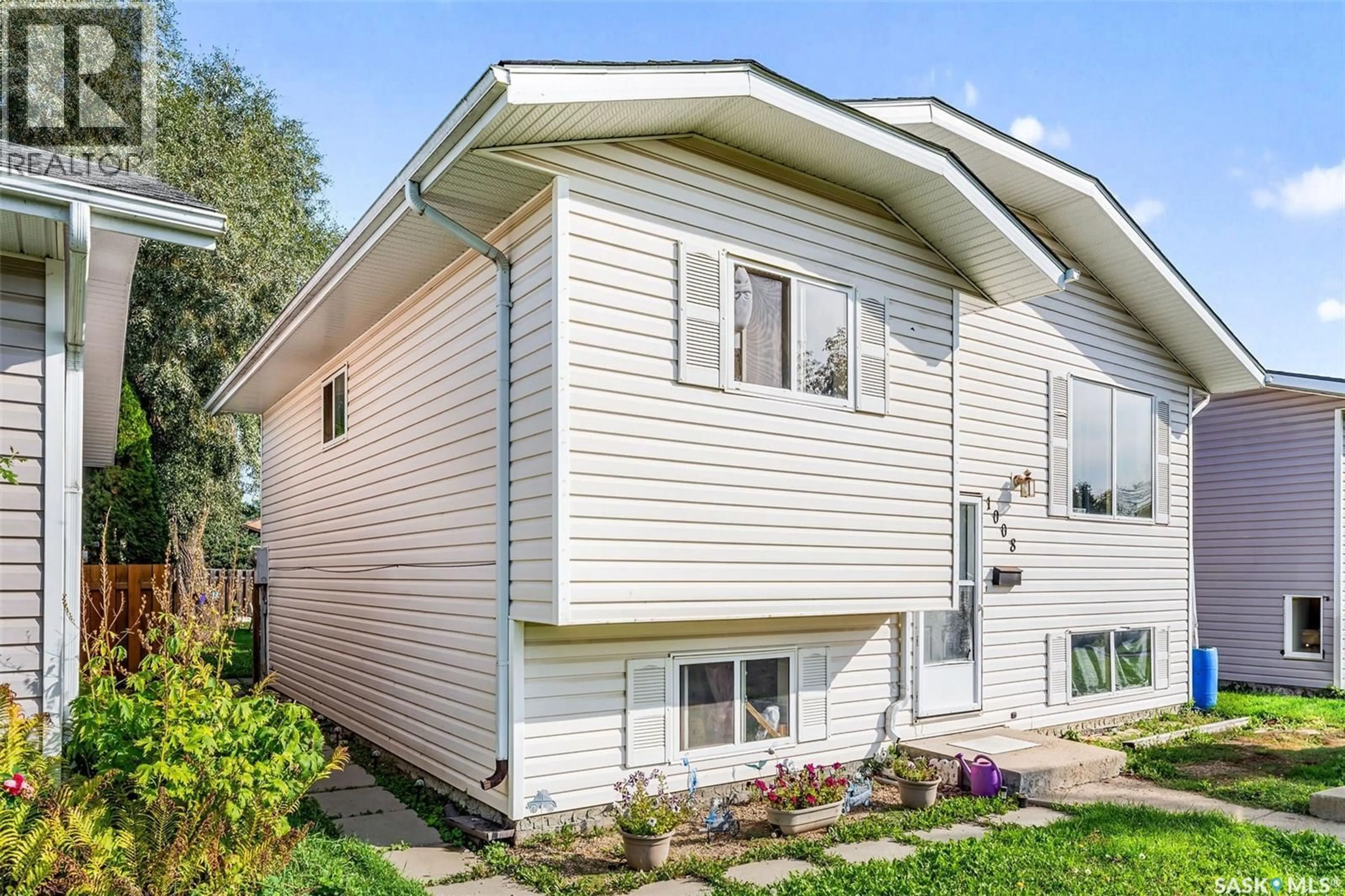 Home with vinyl exterior material, street for 1008 2ND STREET, Prince Albert Saskatchewan S6V0P8