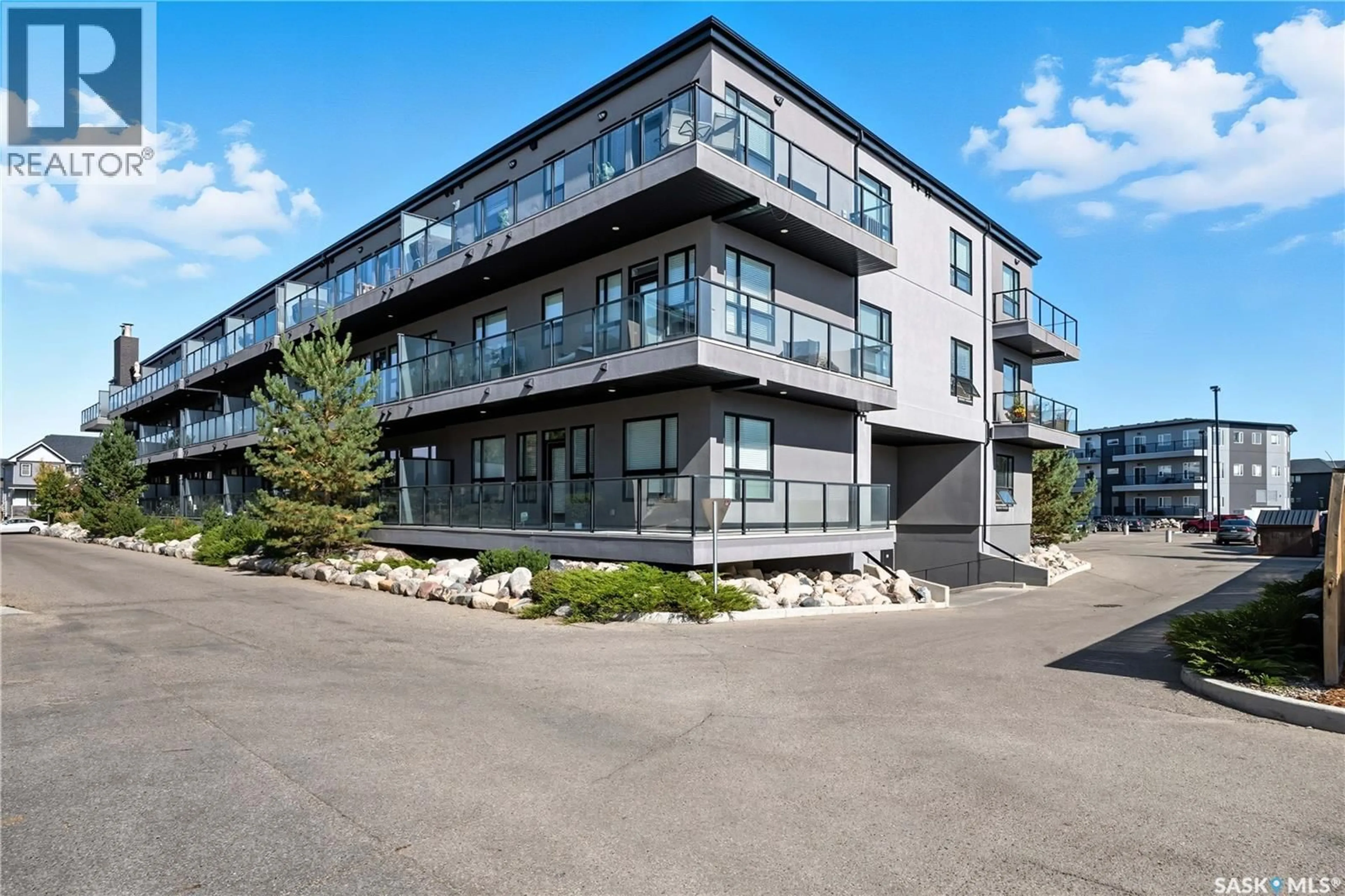 A pic from outside/outdoor area/front of a property/back of a property/a pic from drone, building for 415 - 218 MANINGAS BEND, Saskatoon Saskatchewan S7W0T6