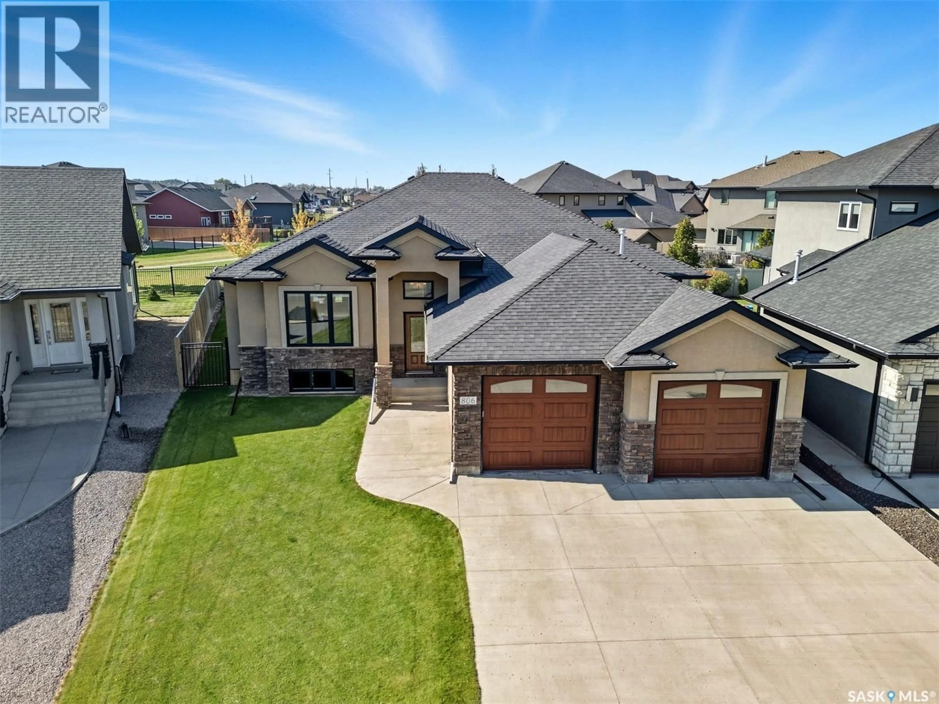A pic from outside/outdoor area/front of a property/back of a property/a pic from drone, street for 806 GILLIES CRESCENT, Saskatoon Saskatchewan S7V0C2