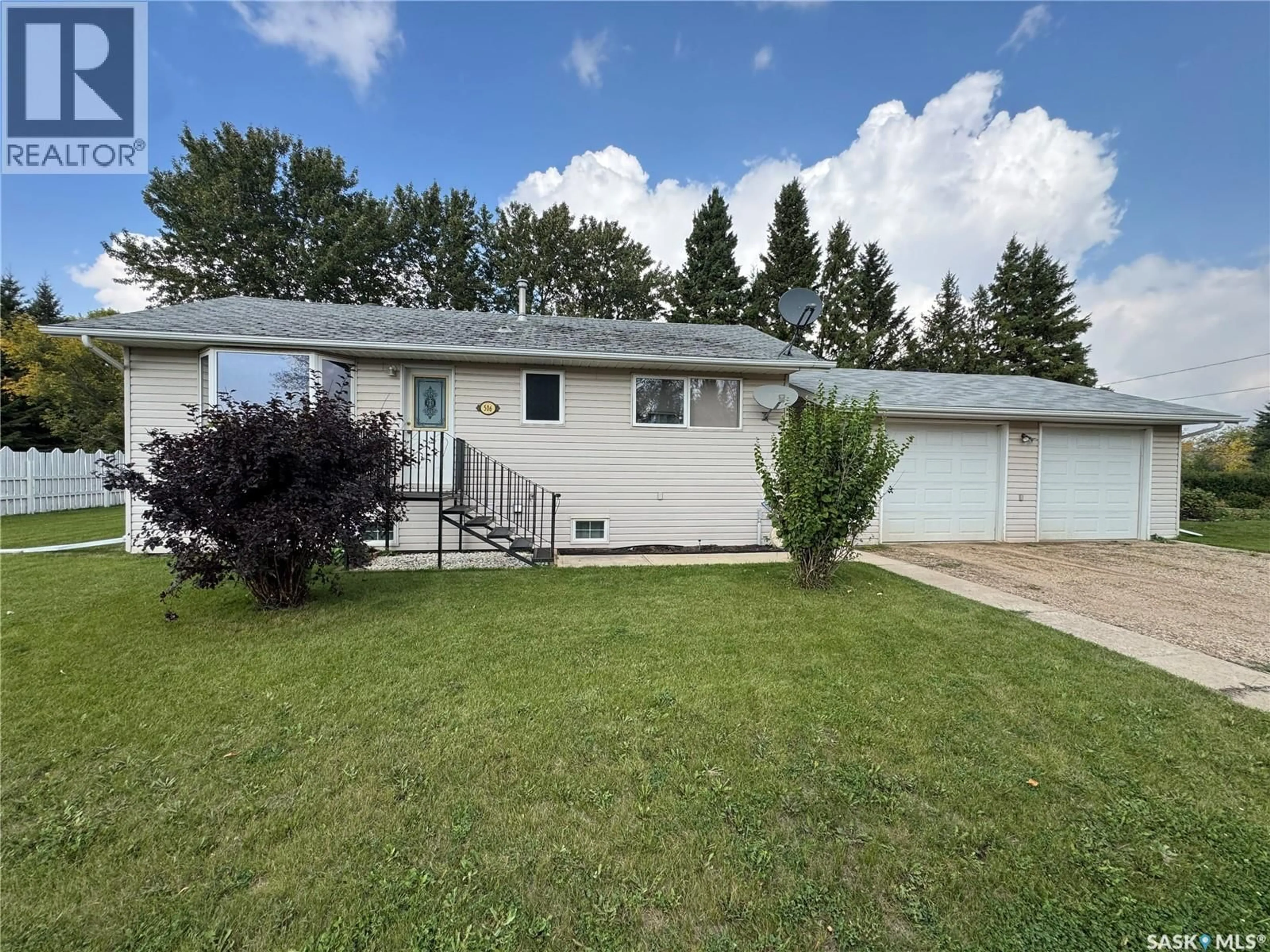 Home with vinyl exterior material, street for 506 4TH STREET, Spalding Saskatchewan S0K4C0