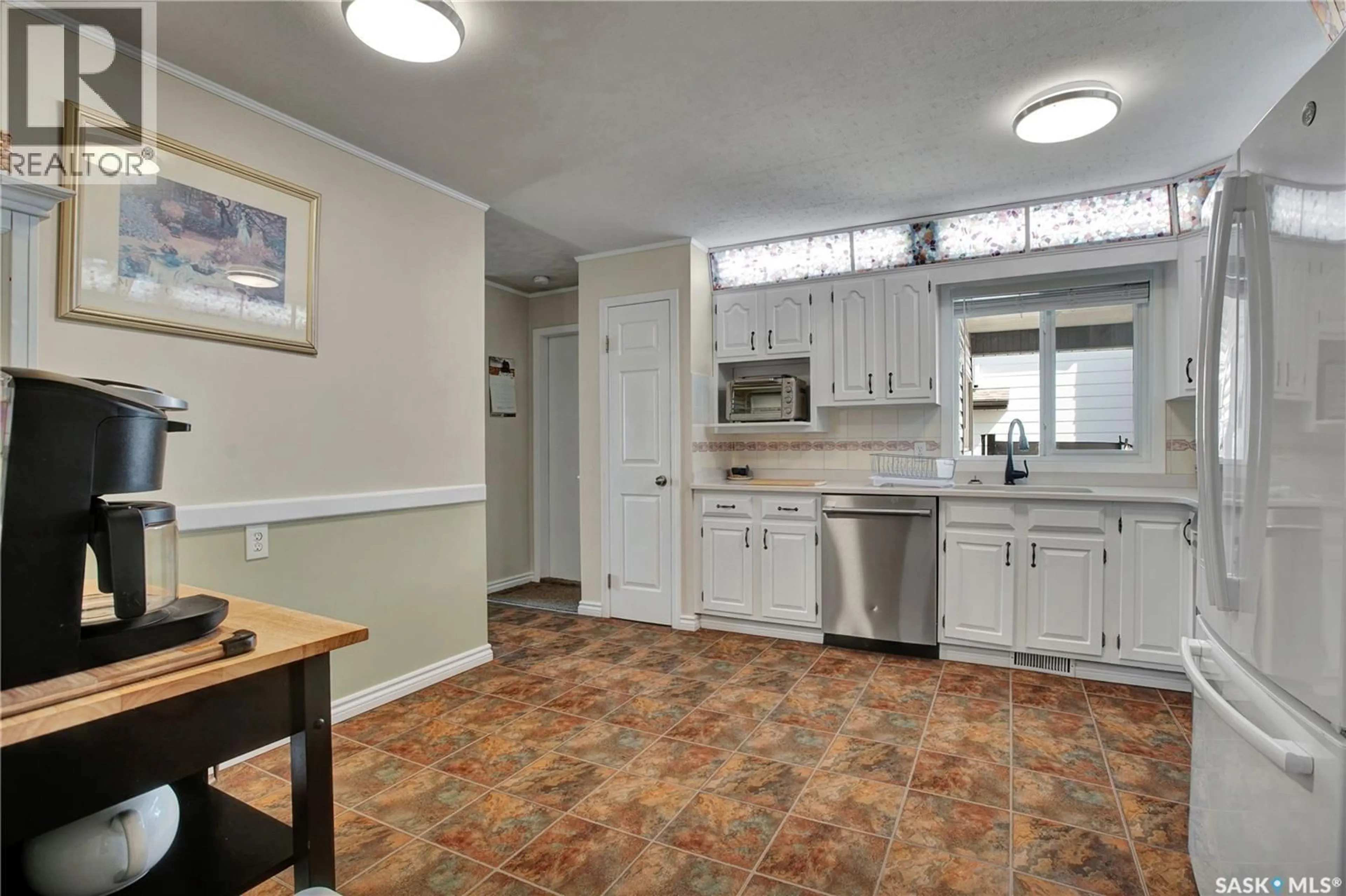 Standard kitchen, ceramic/tile floor for 128 DELARONDE ROAD, Saskatoon Saskatchewan S7J3Y3