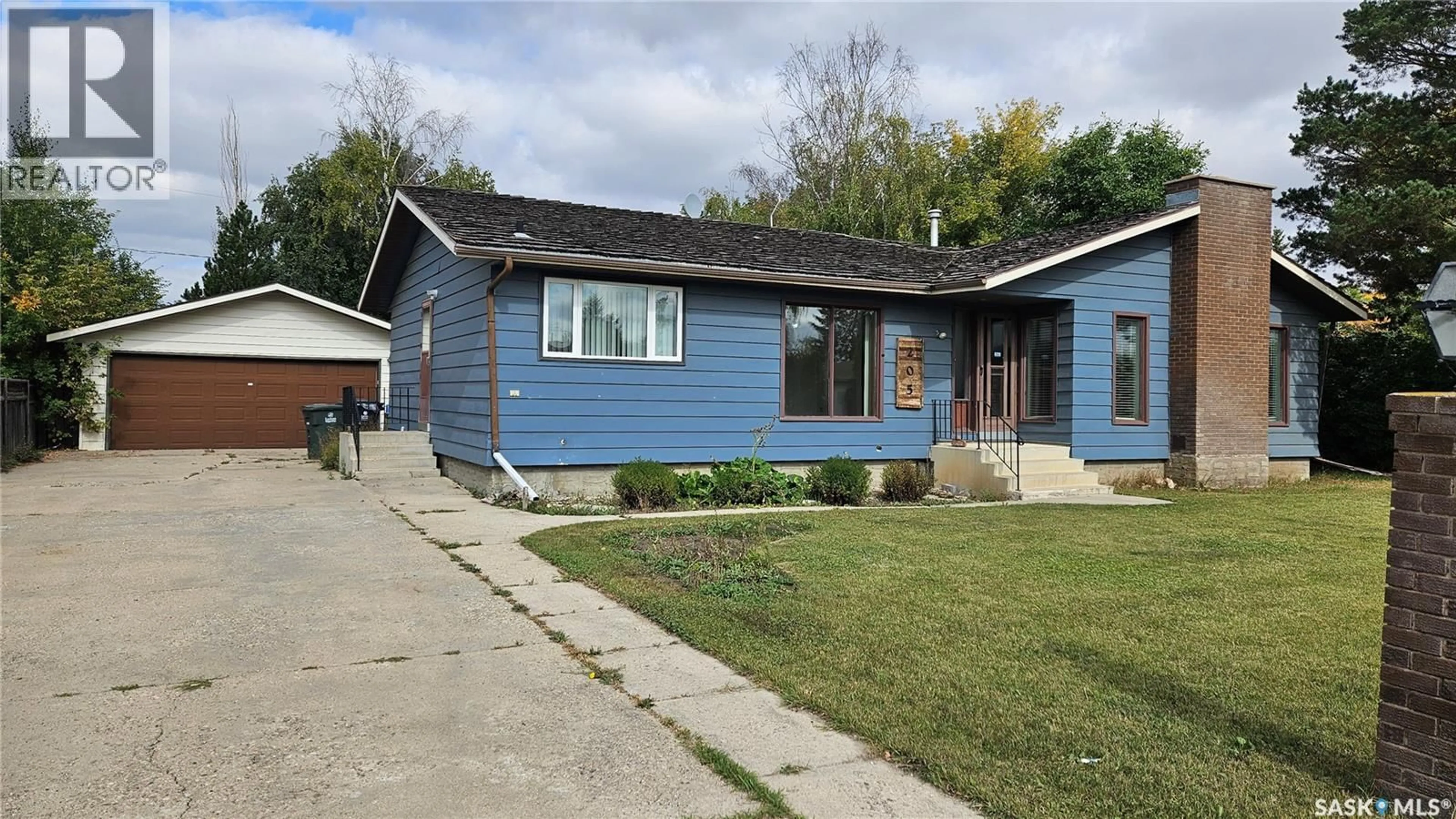 Home with vinyl exterior material, street for W - 205 1ST STREET, Langham Saskatchewan S0K2L0