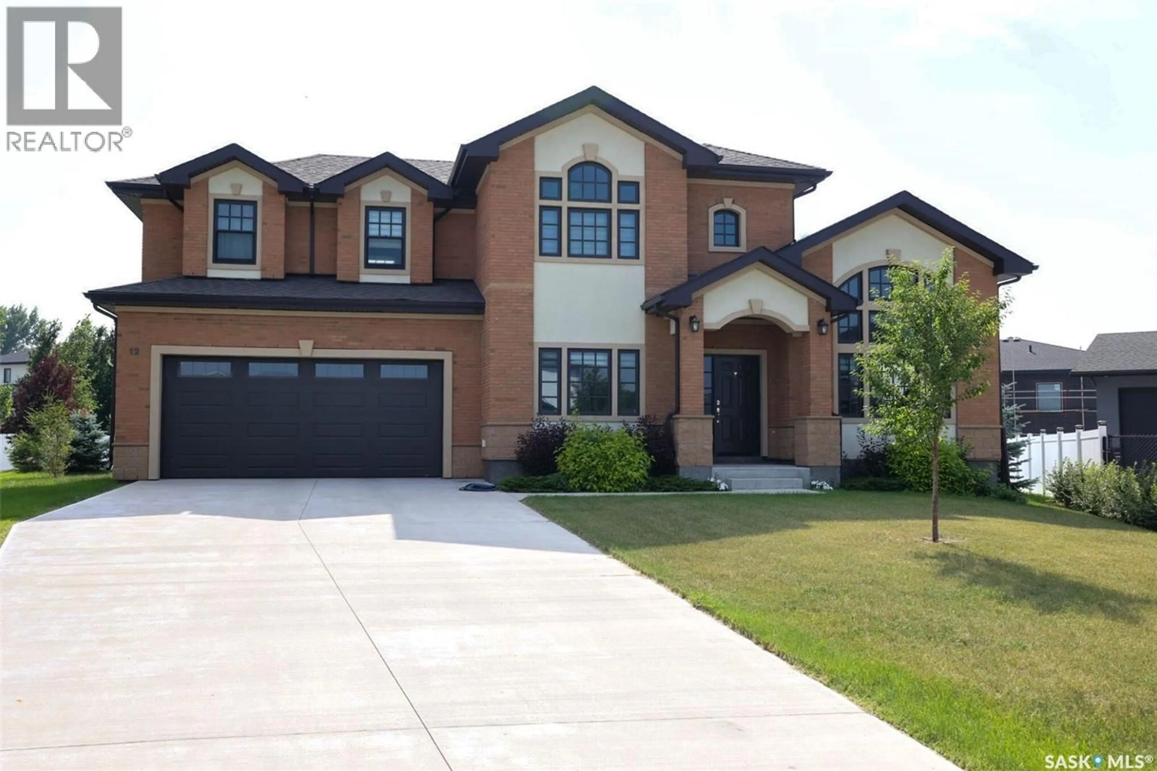 Home with brick exterior material, street for 12 YALE PLACE, White City Saskatchewan S4L0C7