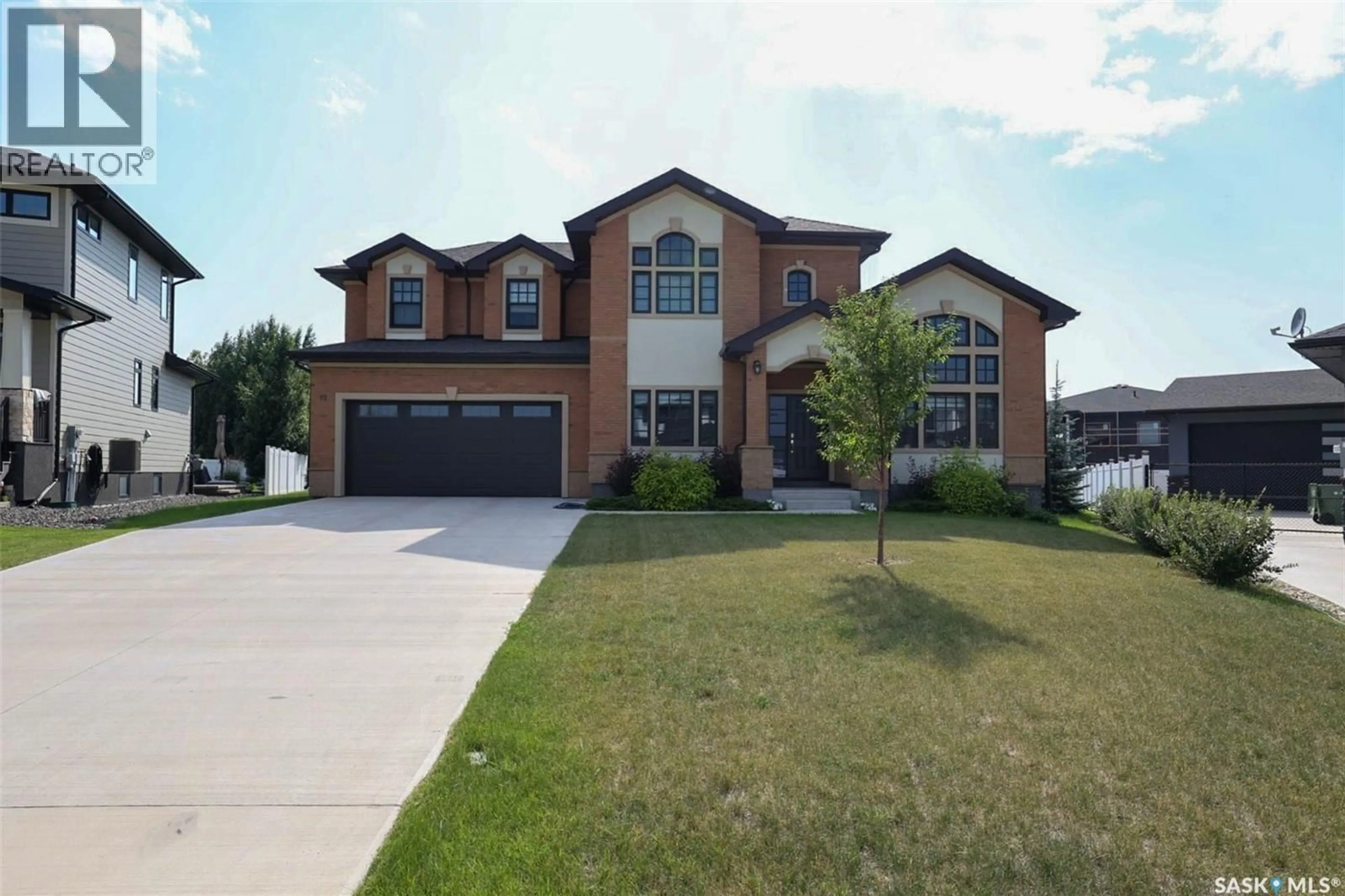 Home with brick exterior material, street for 12 YALE PLACE, White City Saskatchewan S4L0C7
