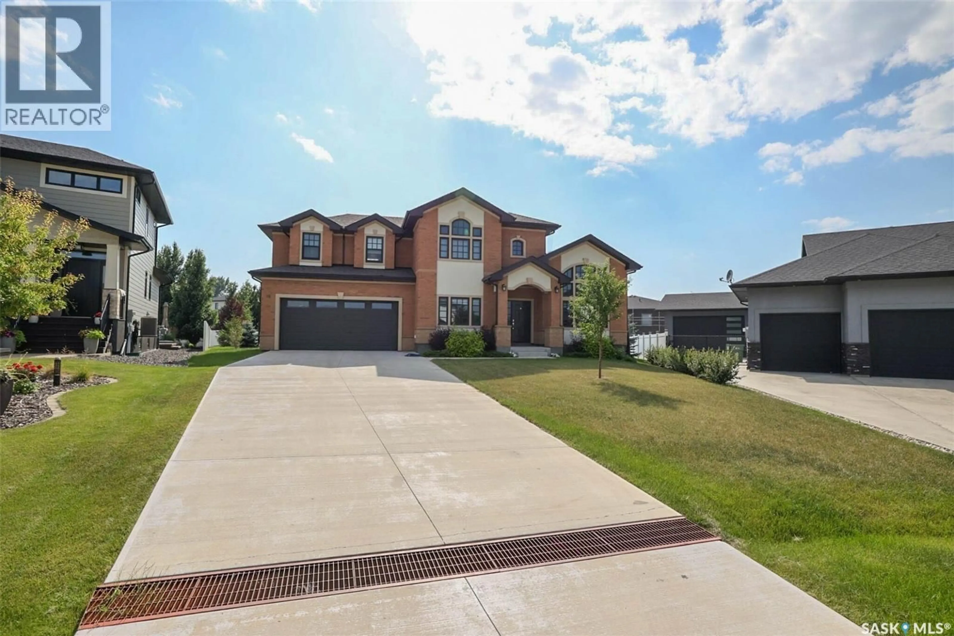 Home with brick exterior material, street for 12 YALE PLACE, White City Saskatchewan S4L0C7