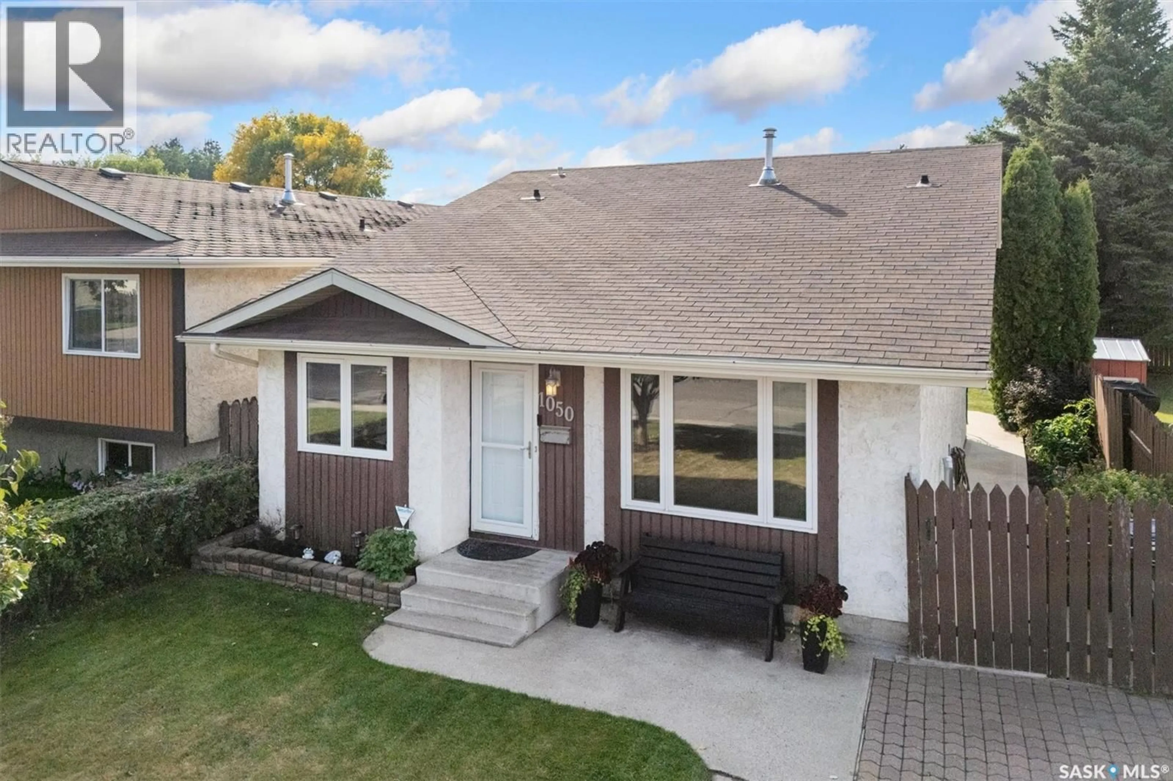 Home with vinyl exterior material, street for 1050 MCCORMACK ROAD, Saskatoon Saskatchewan S7M5K2