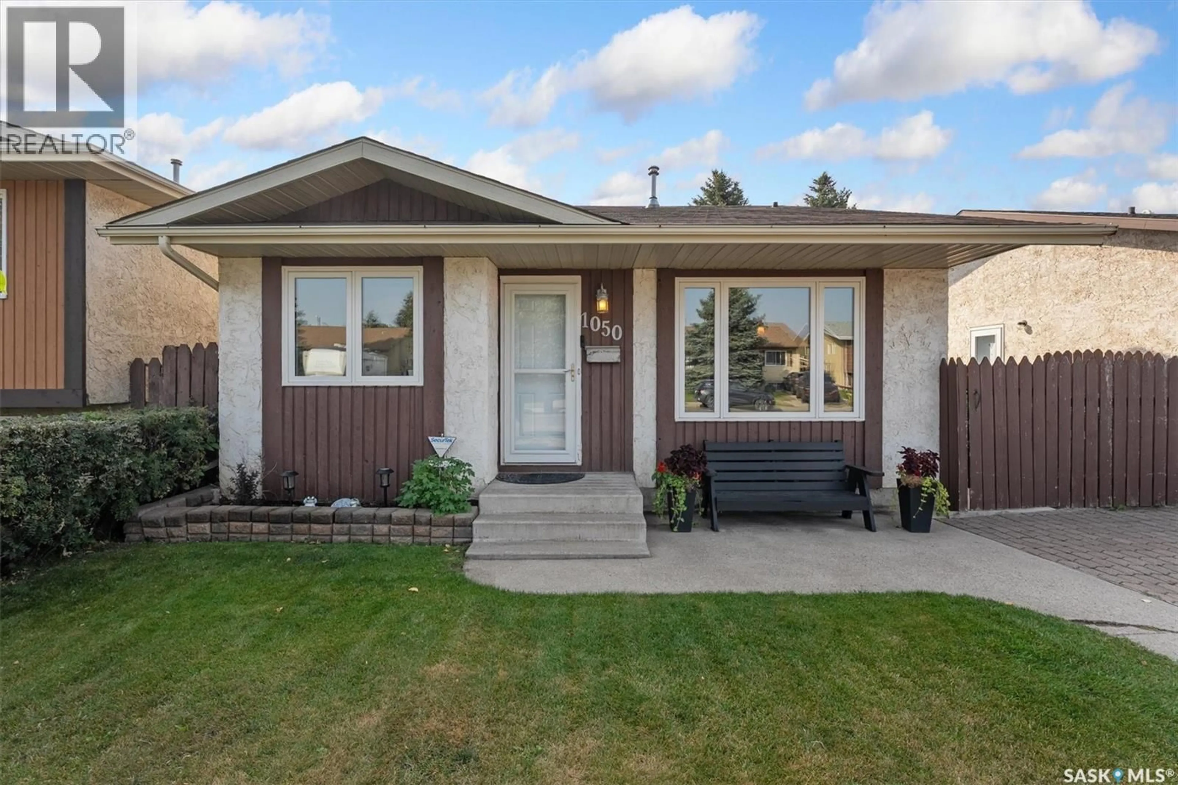 Home with vinyl exterior material, street for 1050 MCCORMACK ROAD, Saskatoon Saskatchewan S7M5K2