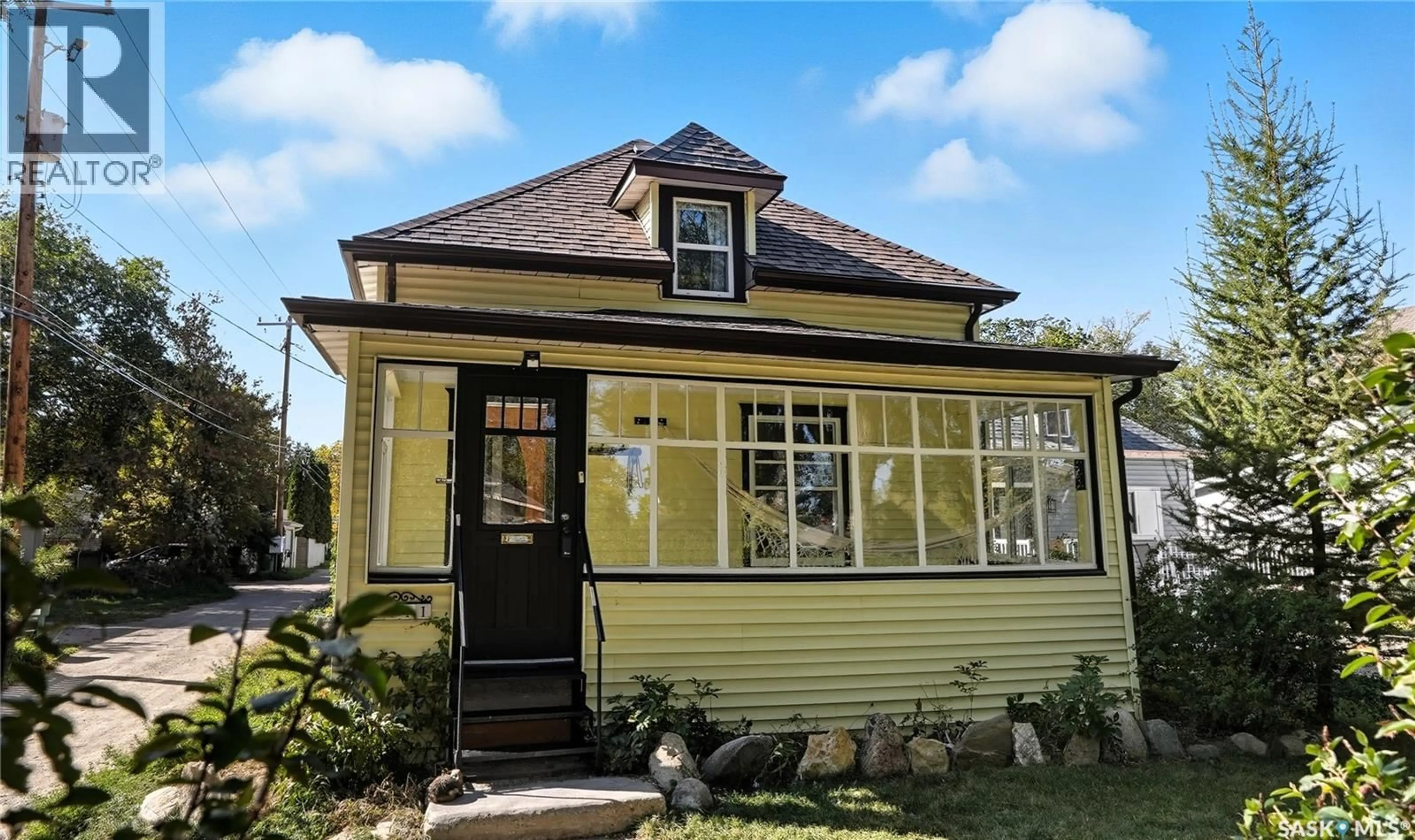 Home with vinyl exterior material, street for 1111 C AVENUE, Saskatoon Saskatchewan S7L1K3