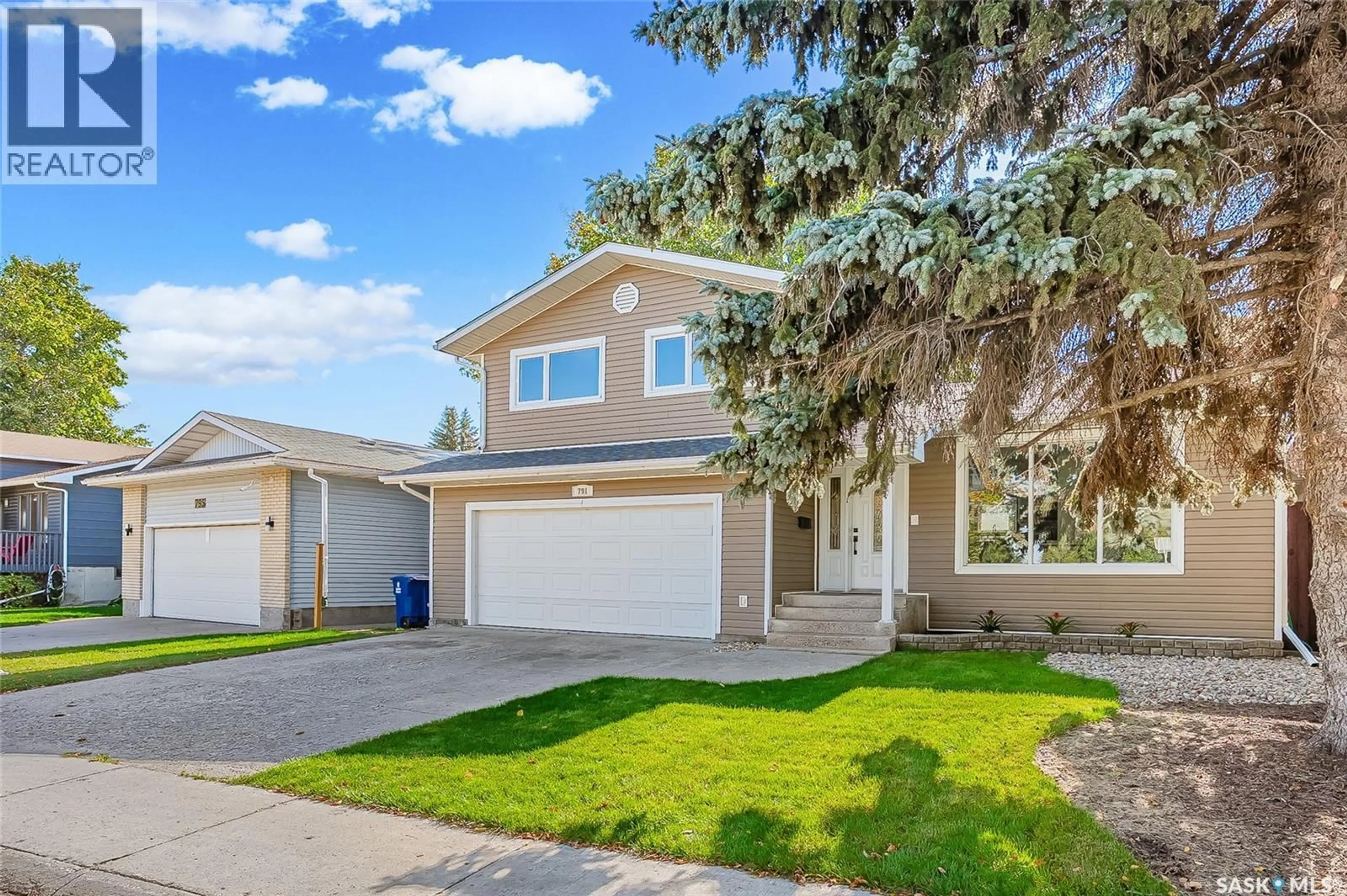 Home with vinyl exterior material, street for 791 LENORE DRIVE, Saskatoon Saskatchewan S7K5G9
