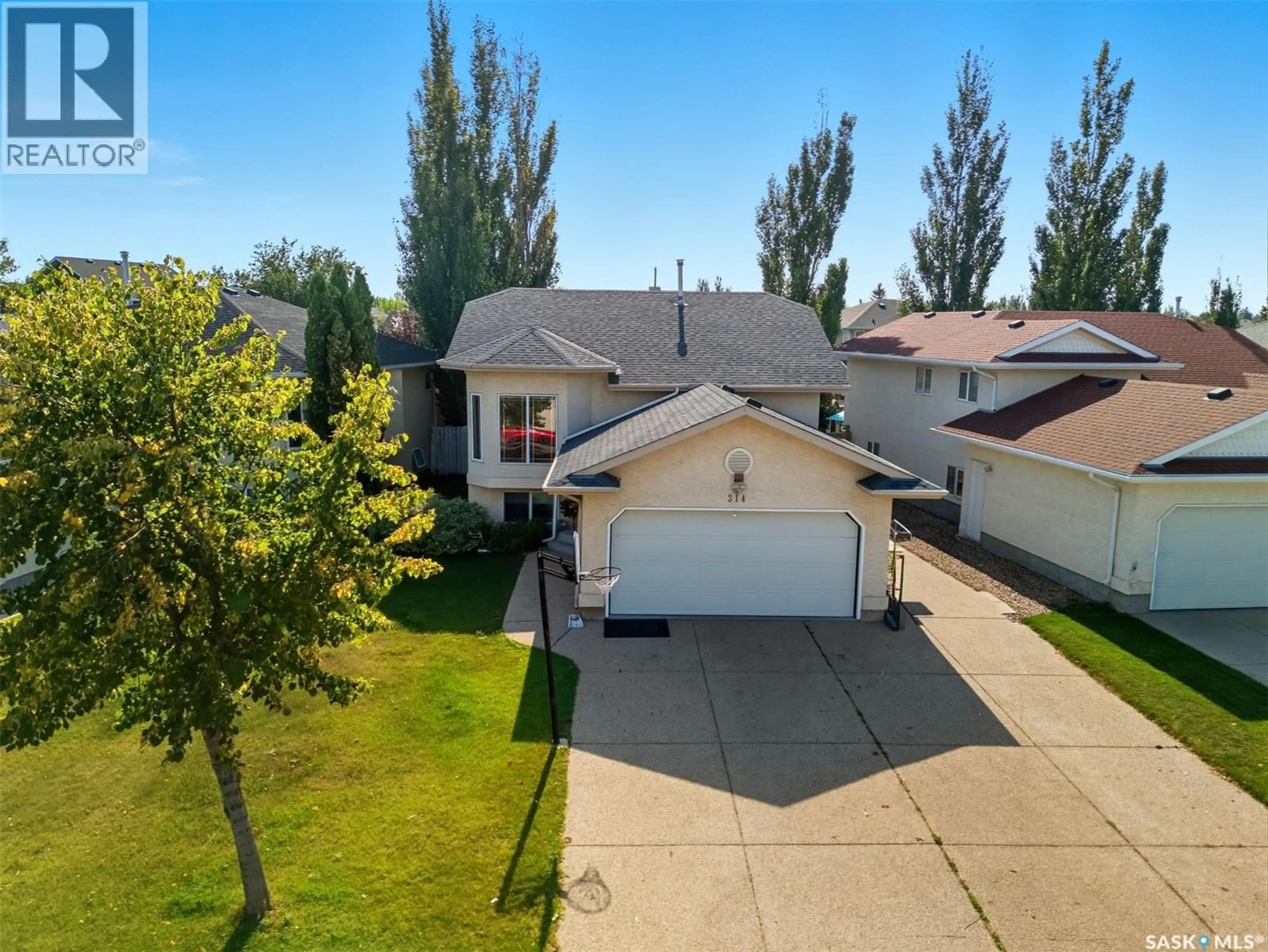 A pic from outside/outdoor area/front of a property/back of a property/a pic from drone, street for 314 BUDZ CRESCENT, Saskatoon Saskatchewan S7N4M5