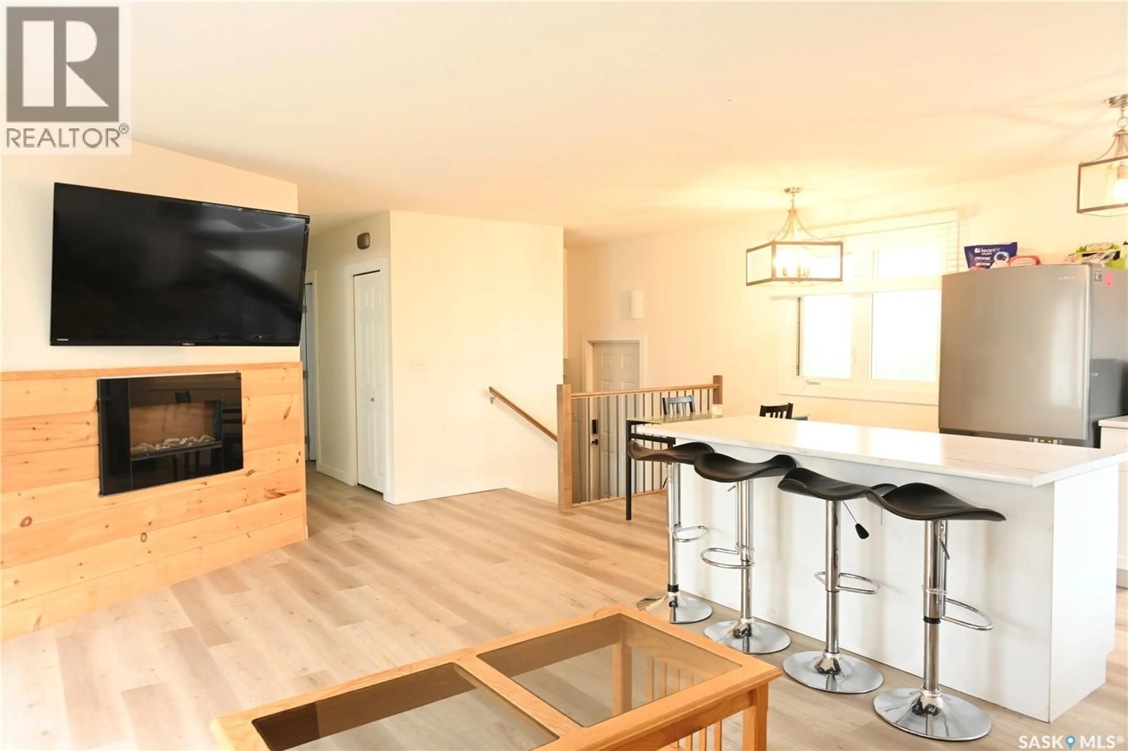 Open concept kitchen, wood/laminate floor for 103 3RD AVENUE, Hanley Saskatchewan S0G2E0