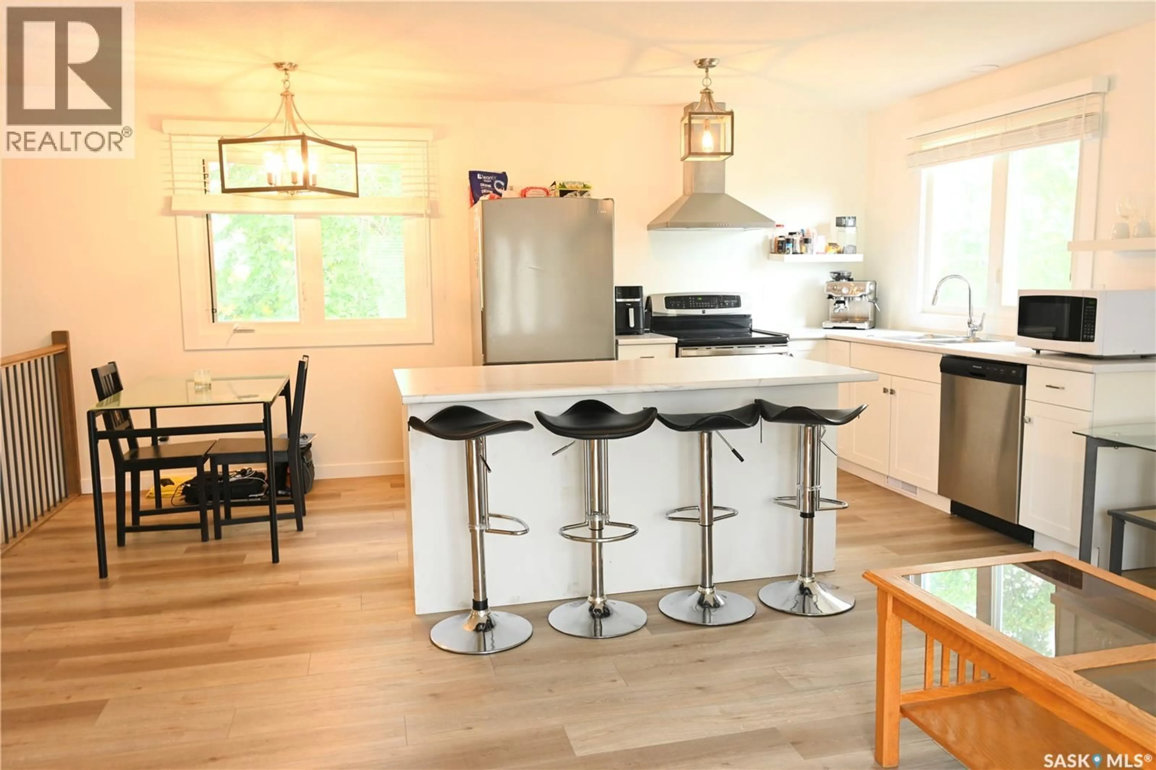 Open concept kitchen, wood/laminate floor for 103 3RD AVENUE, Hanley Saskatchewan S0G2E0