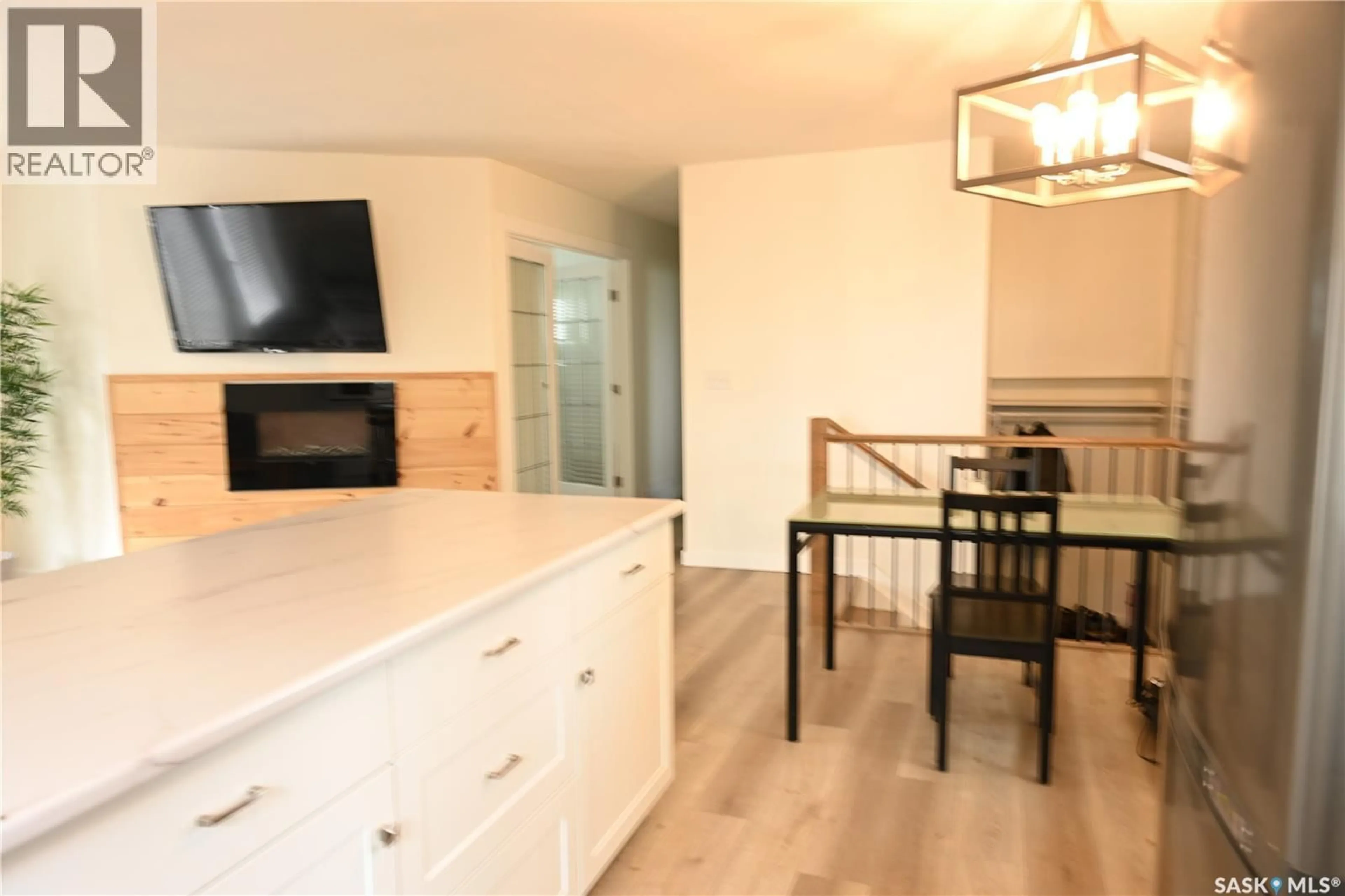 Open concept kitchen, wood/laminate floor for 103 3RD AVENUE, Hanley Saskatchewan S0G2E0