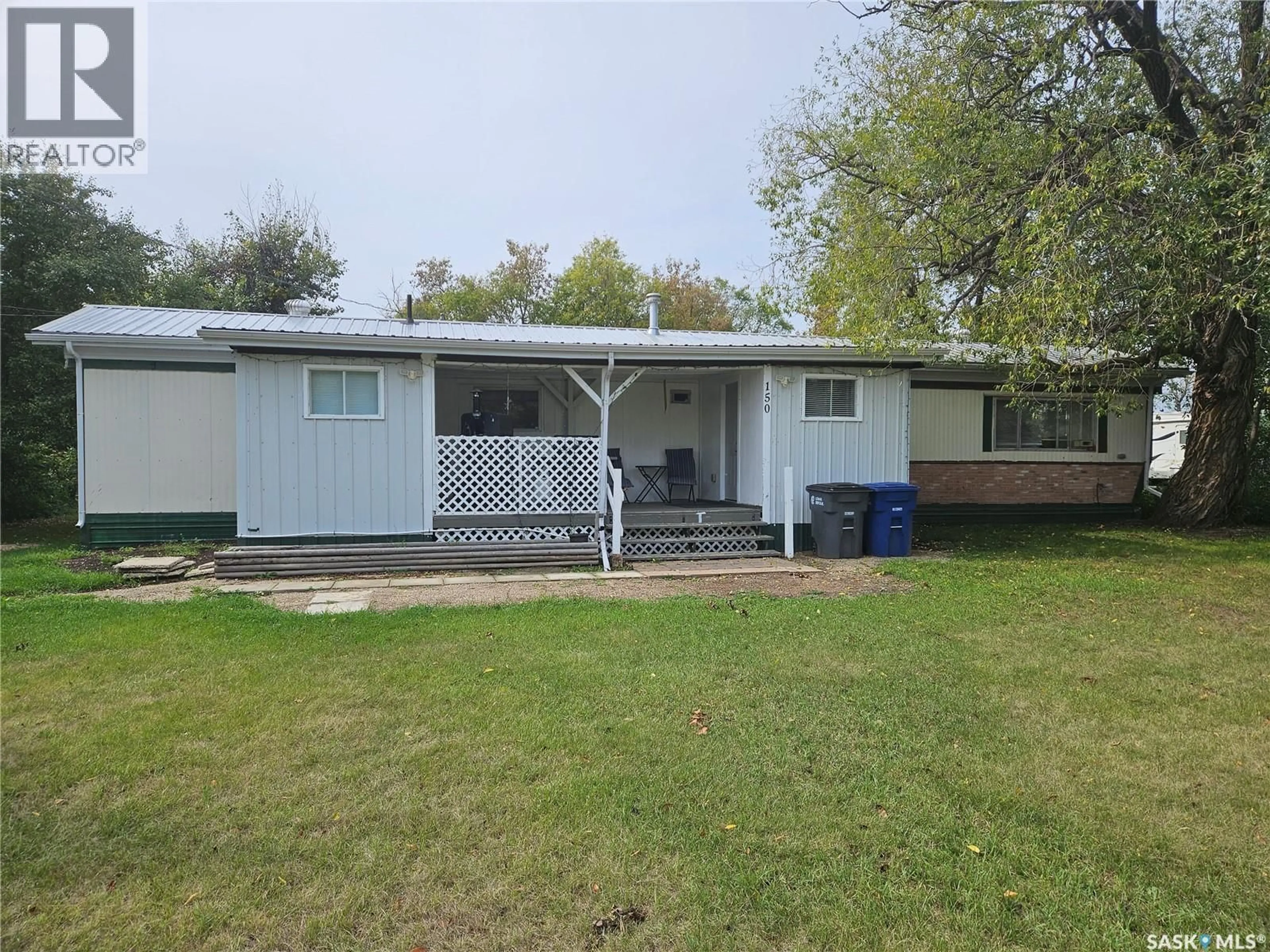 Home with vinyl exterior material, street for 150 MORLEY STREET, Kisbey Saskatchewan S0C1L0