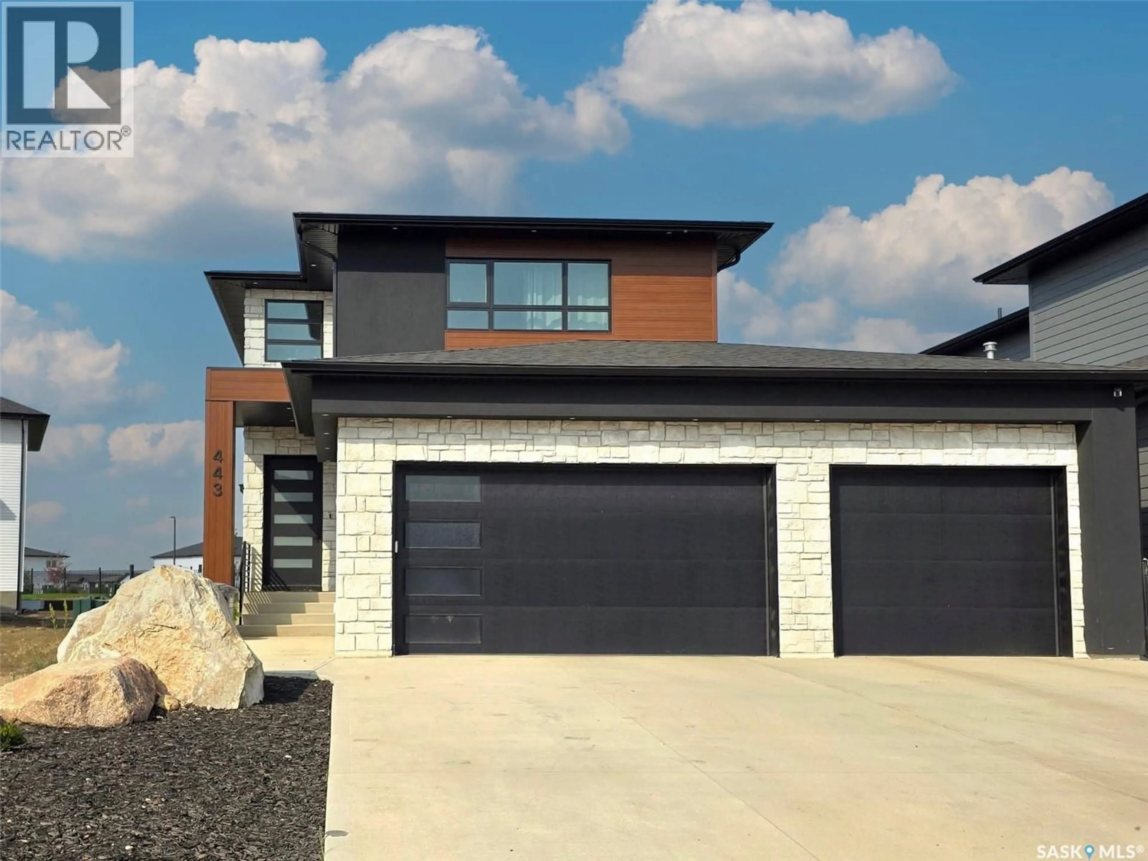 Home with brick exterior material, street for 443 WOOLF BEND, Saskatoon Saskatchewan S7W1E4