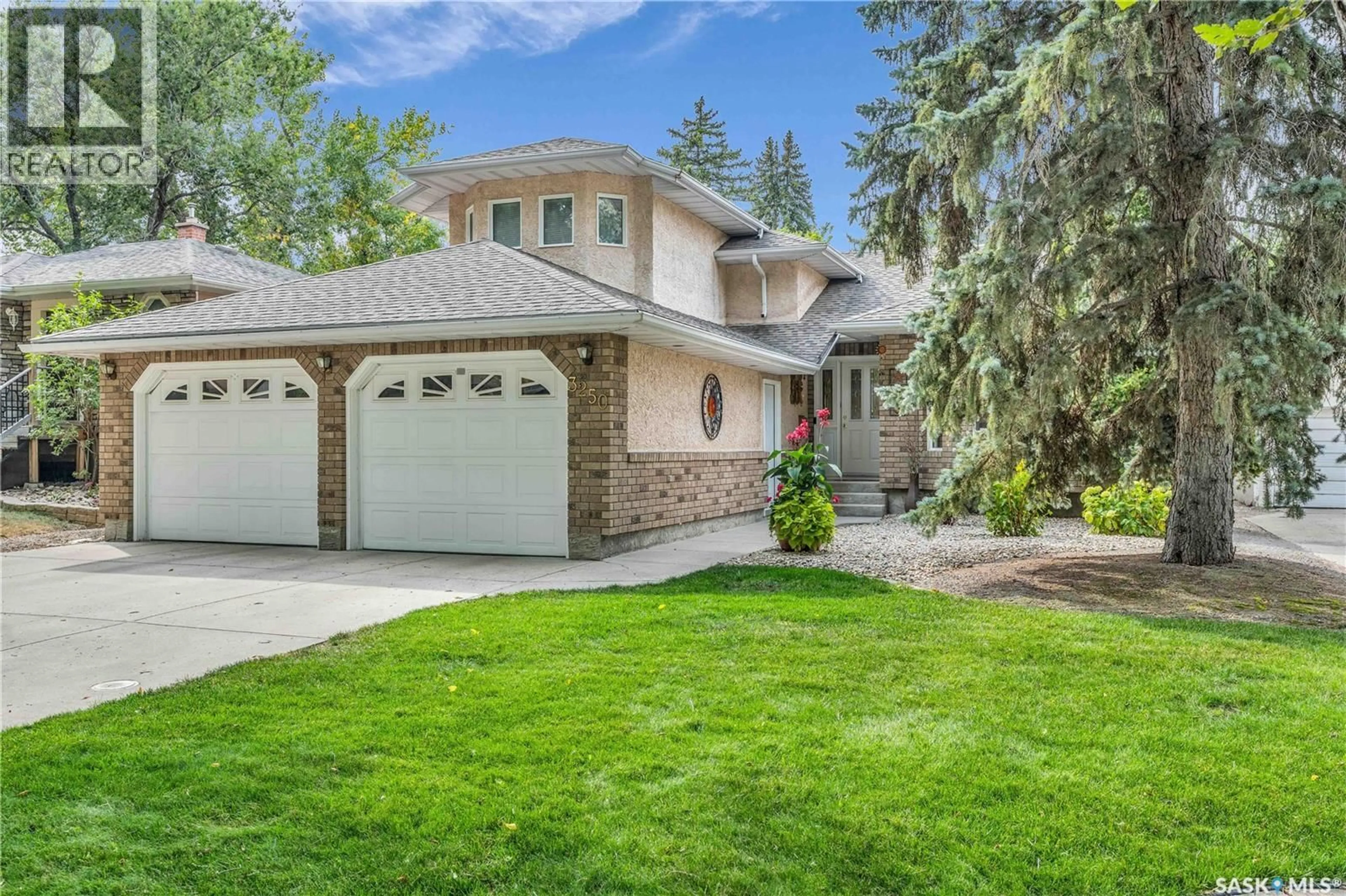 Home with vinyl exterior material, street for 3250 RAE STREET, Regina Saskatchewan S4S1S2