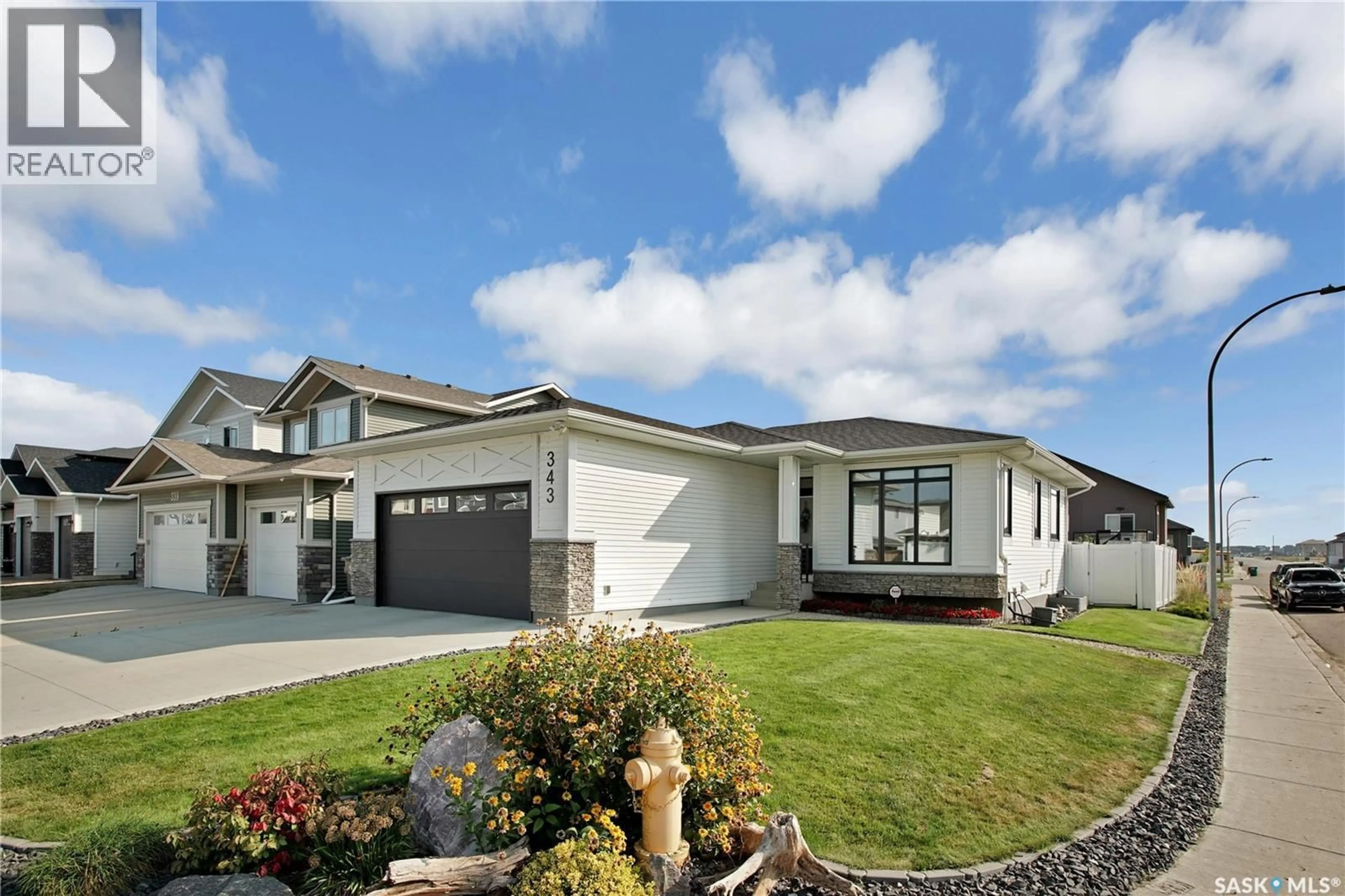 Home with vinyl exterior material, street for 343 HAMM WAY, Saskatoon Saskatchewan S7V0W3