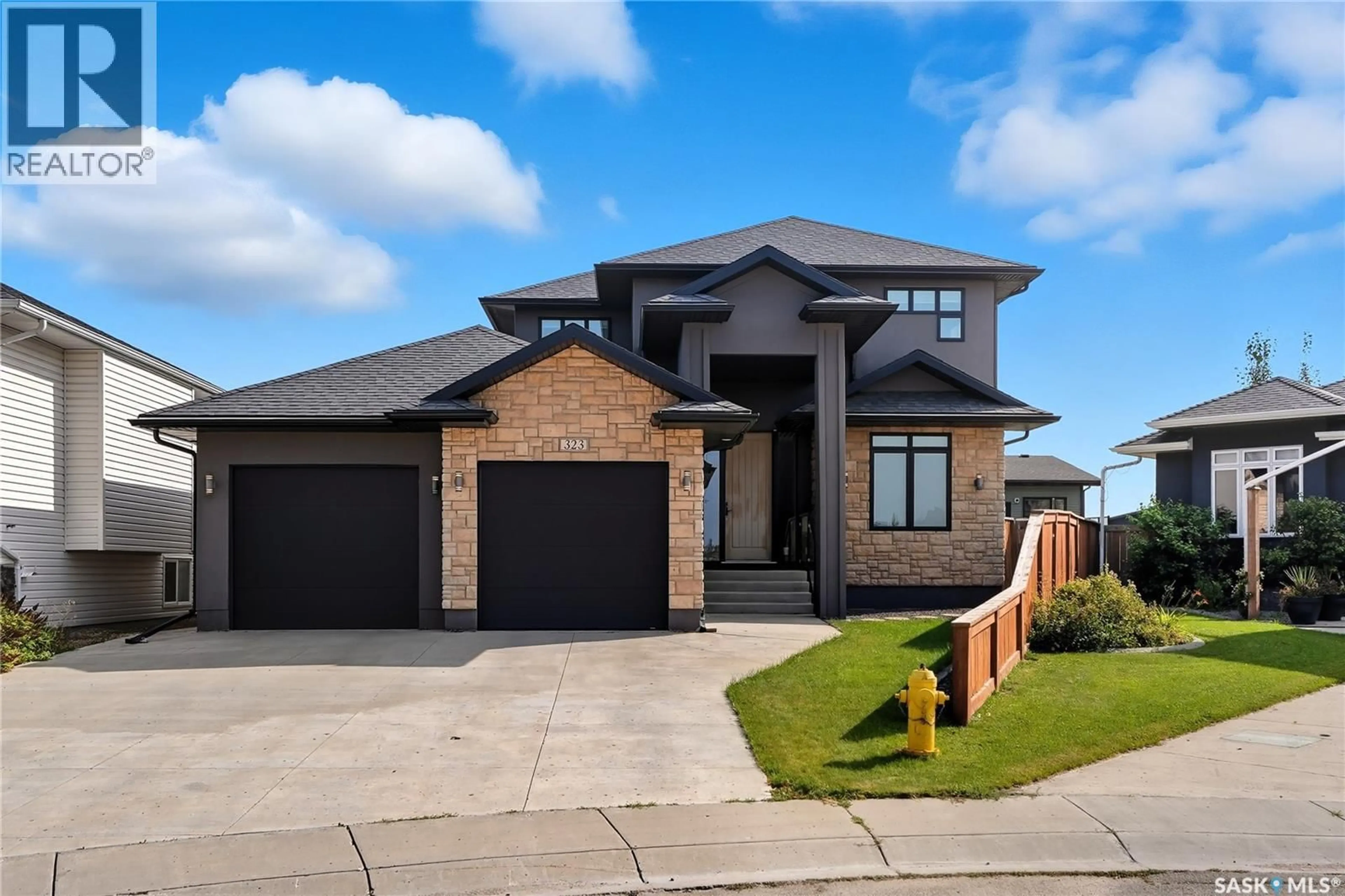 Home with brick exterior material, street for 323 ATTON CRESCENT, Saskatoon Saskatchewan S7W0K8