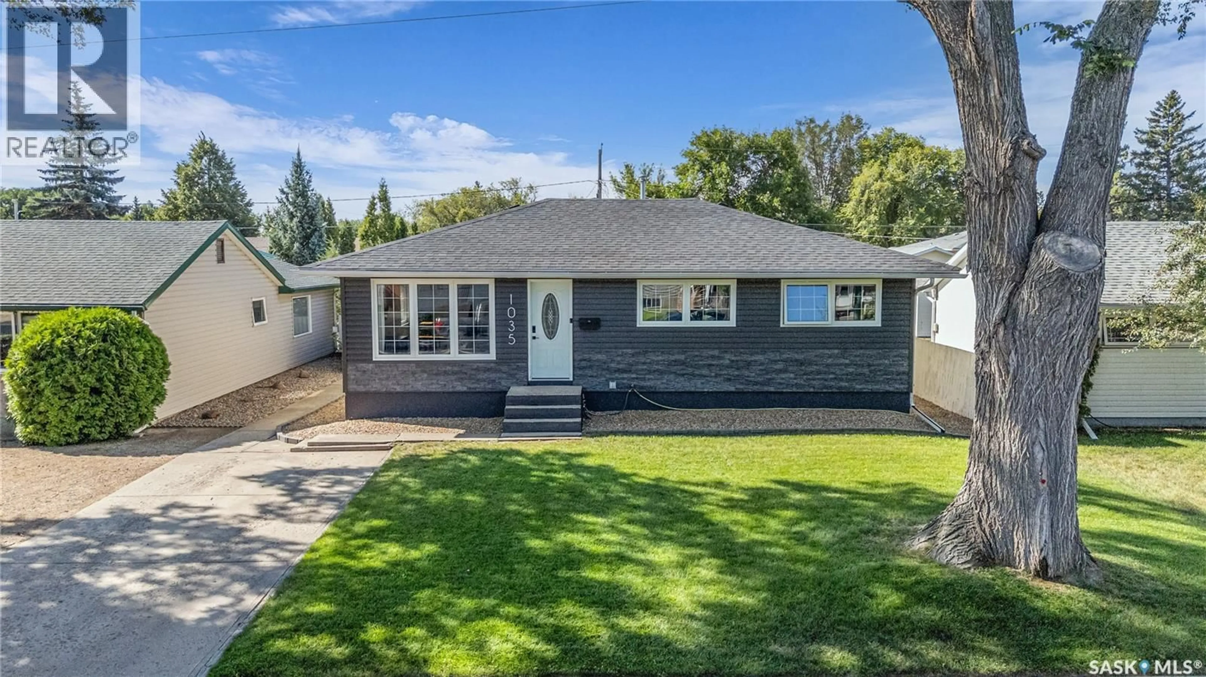 Home with vinyl exterior material, street for 1035 HALL STREET, Moose Jaw Saskatchewan S6H2S5