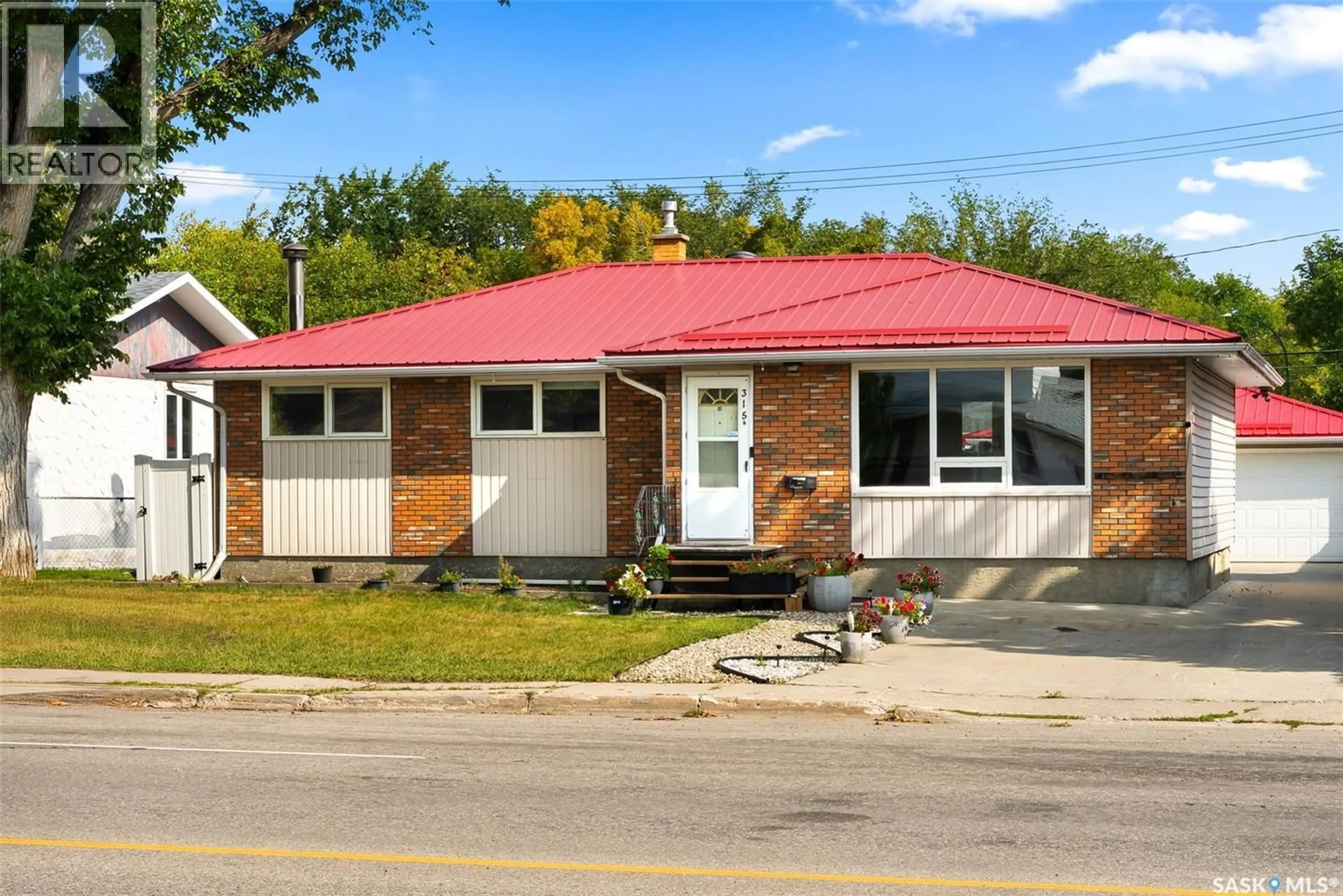 Home with brick exterior material, street for 315 MCINTOSH STREET, Regina Saskatchewan S4R5A1