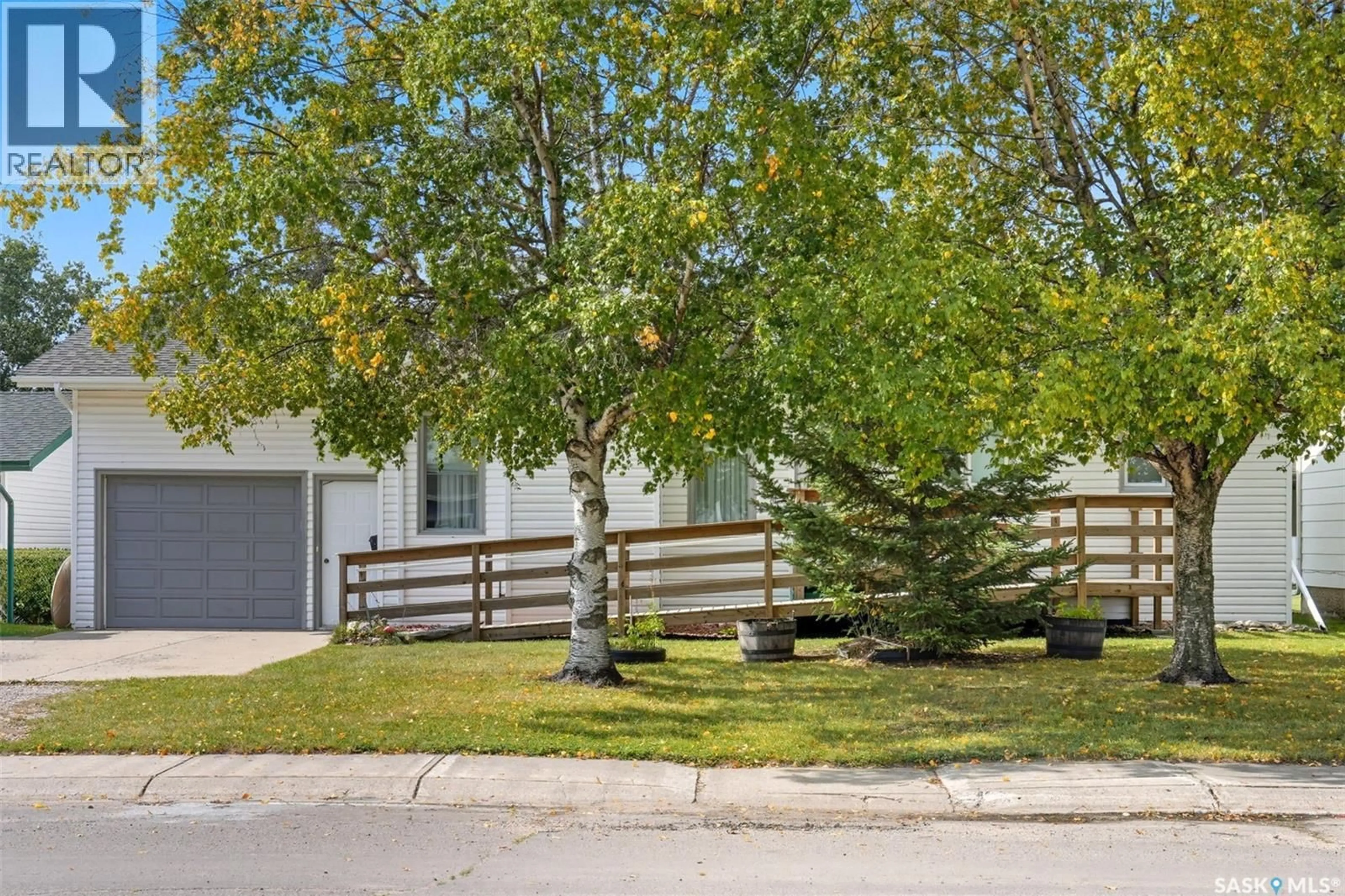 A pic from outside/outdoor area/front of a property/back of a property/a pic from drone, street for 1211 16TH STREET, Humboldt Saskatchewan S0K2A0
