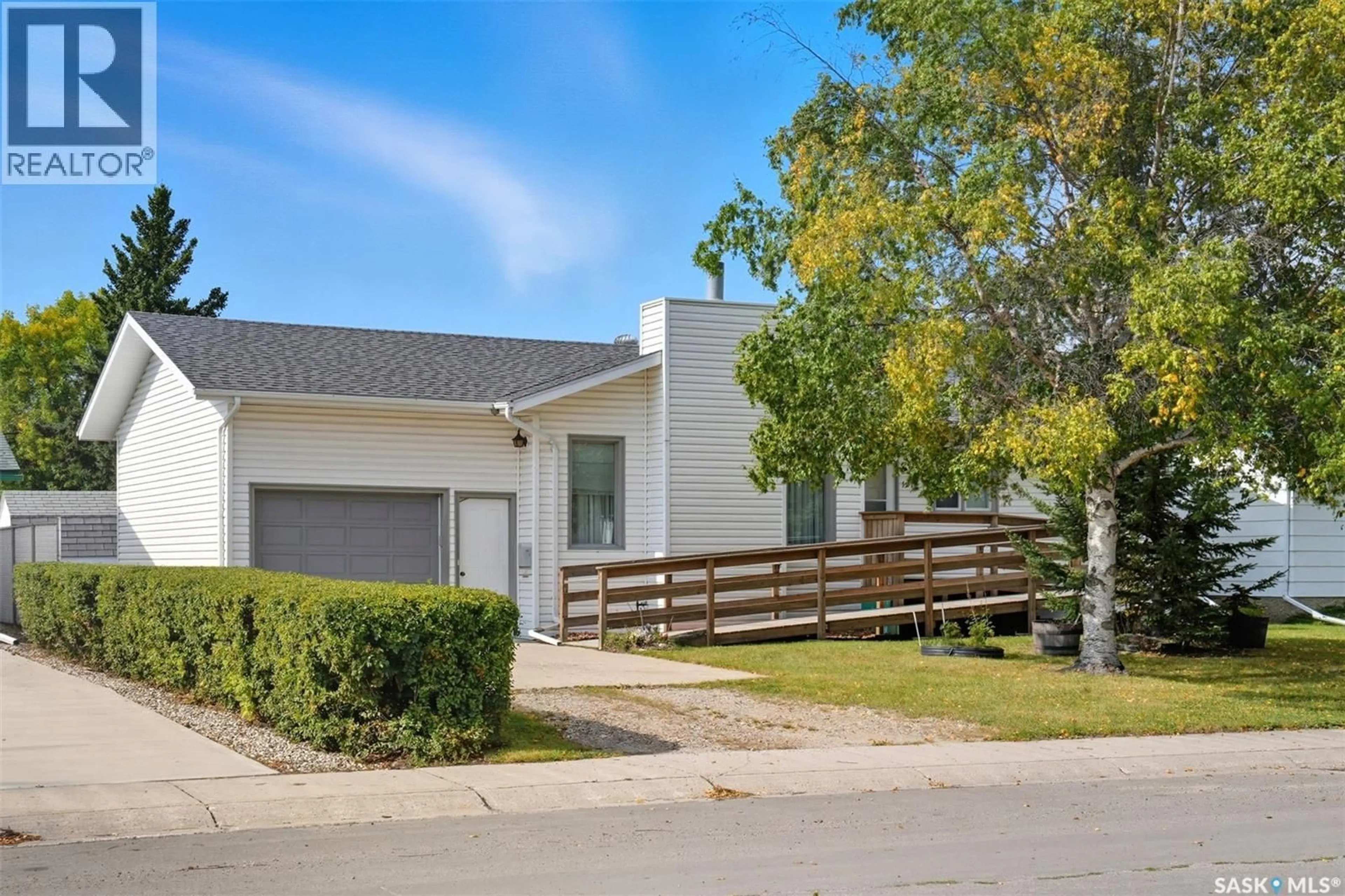 Home with vinyl exterior material, street for 1211 16TH STREET, Humboldt Saskatchewan S0K2A0