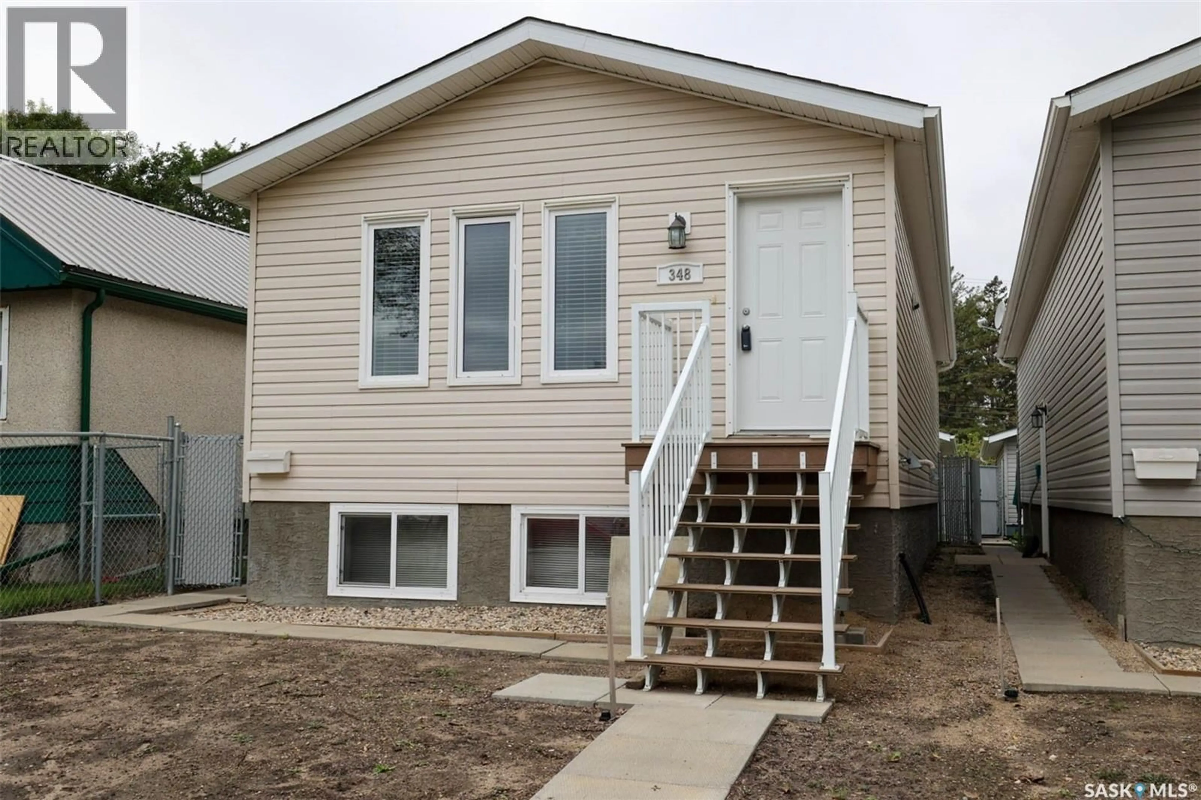 Home with vinyl exterior material, street for 348 ROBINSON STREET, Regina Saskatchewan S4R3R2