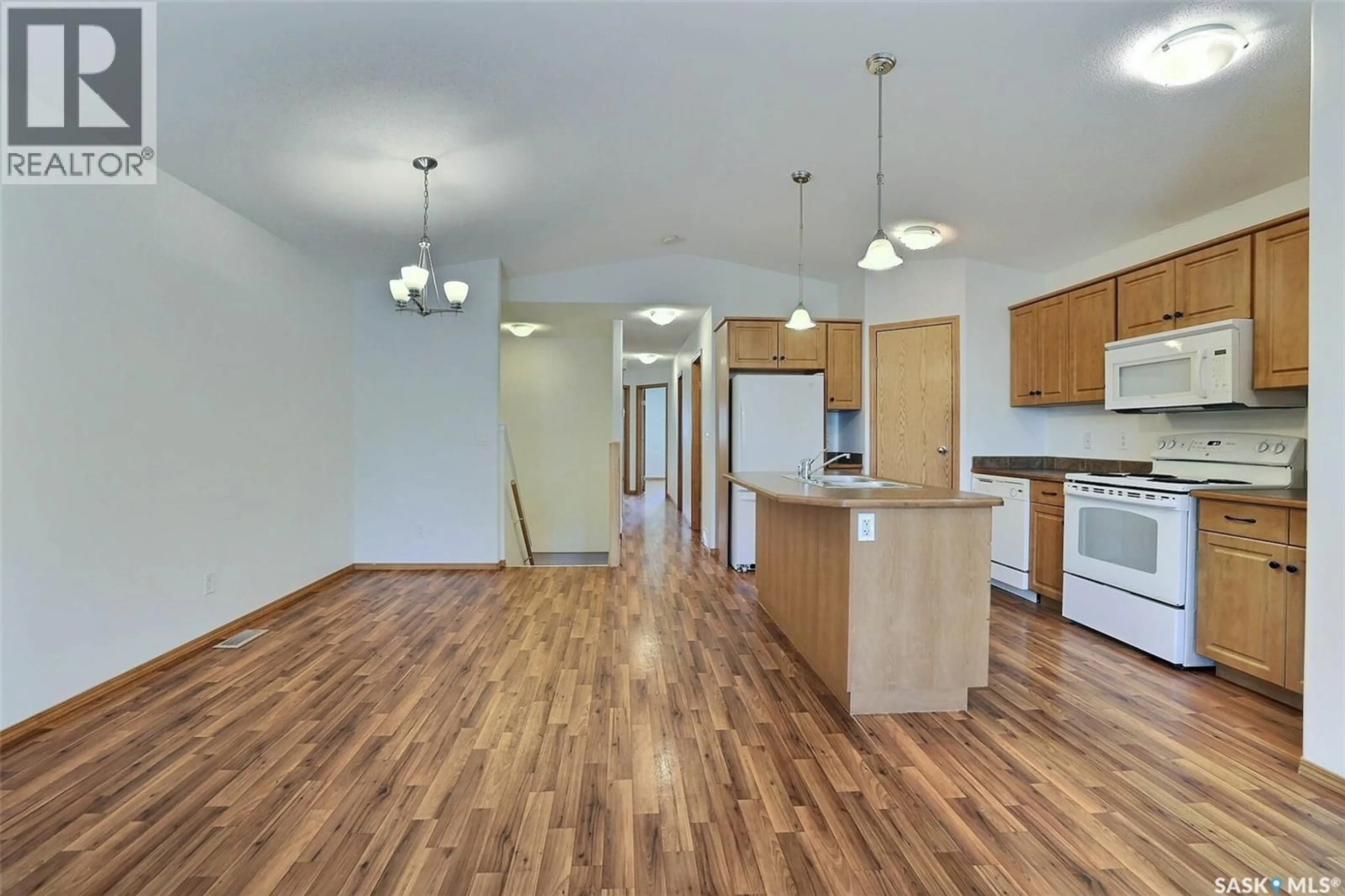 Open concept kitchen, wood/laminate floor for 348 ROBINSON STREET, Regina Saskatchewan S4R3R2