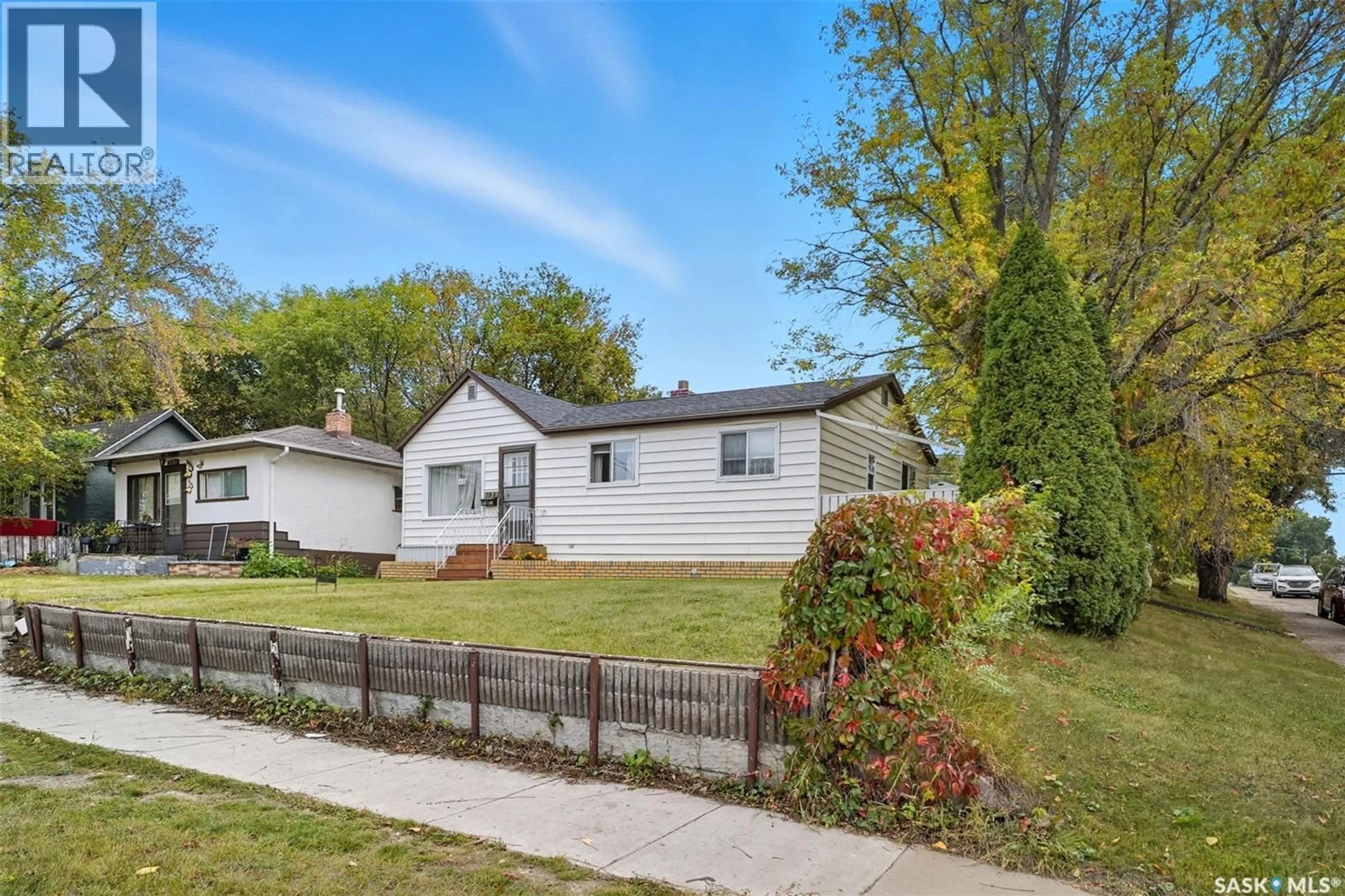 Home with vinyl exterior material, street for 2123 20TH STREET, Saskatoon Saskatchewan S7M1A7