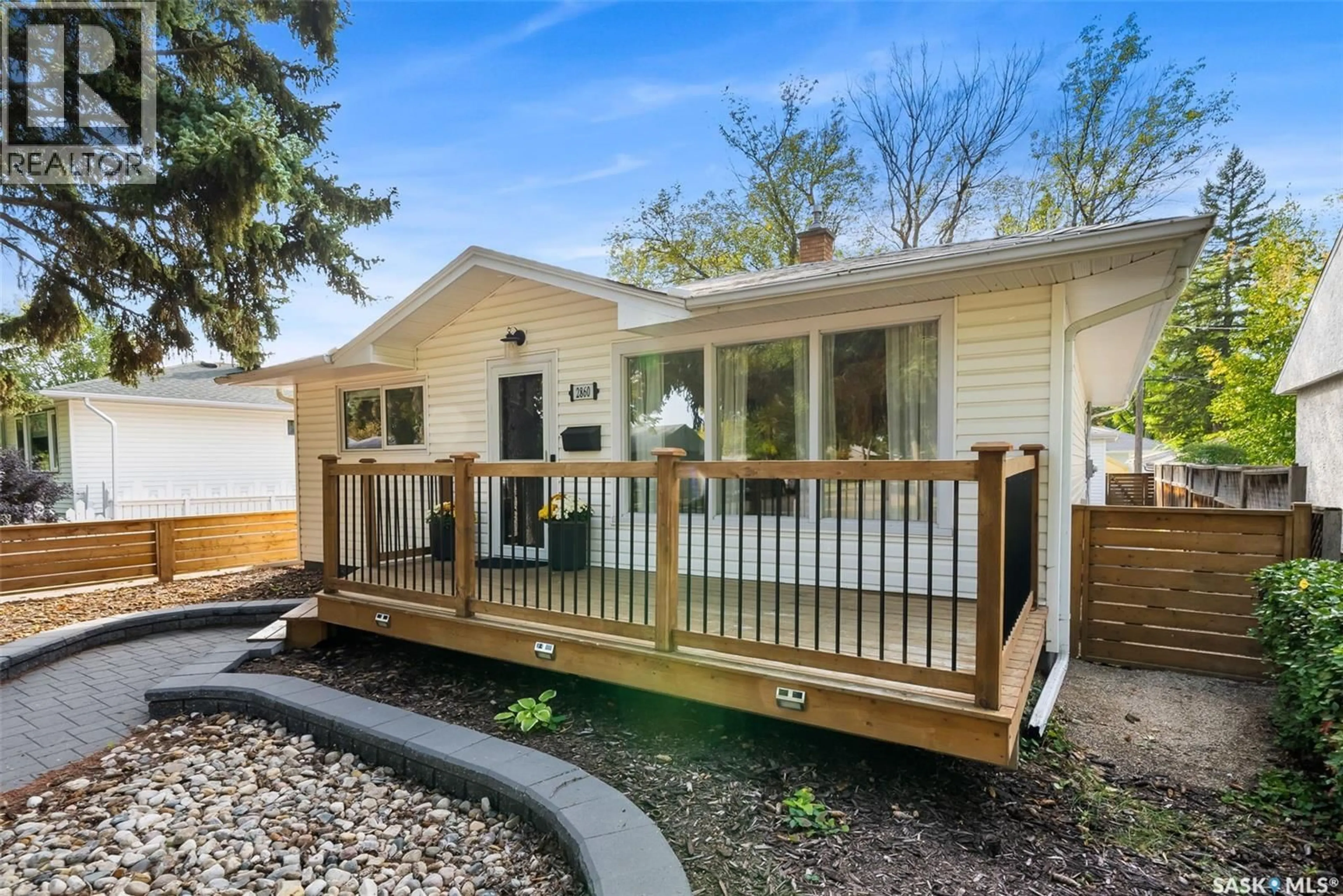 Home with vinyl exterior material, street for 2860 QUEEN STREET, Regina Saskatchewan S4S2E4