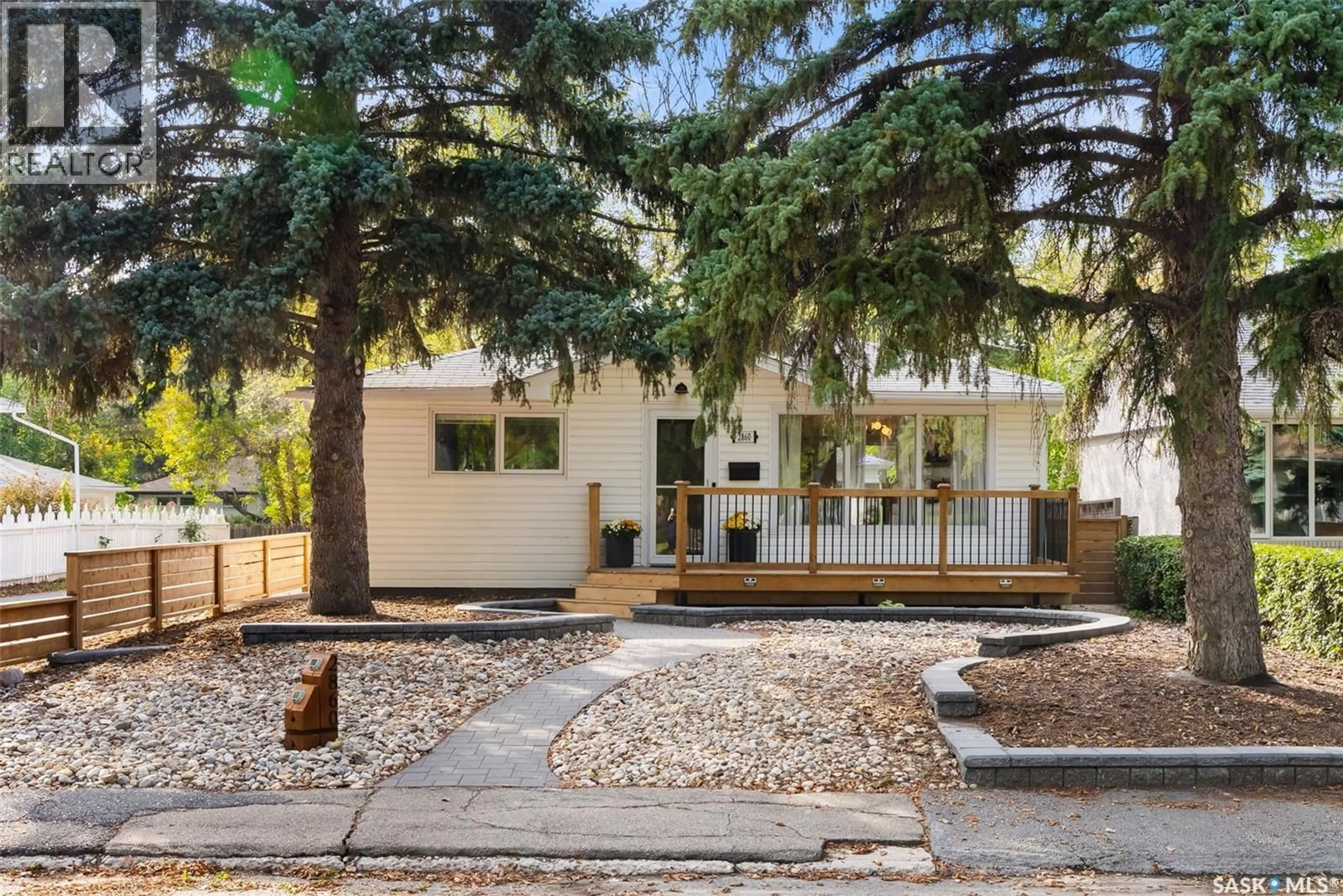 Home with vinyl exterior material, street for 2860 QUEEN STREET, Regina Saskatchewan S4S2E4