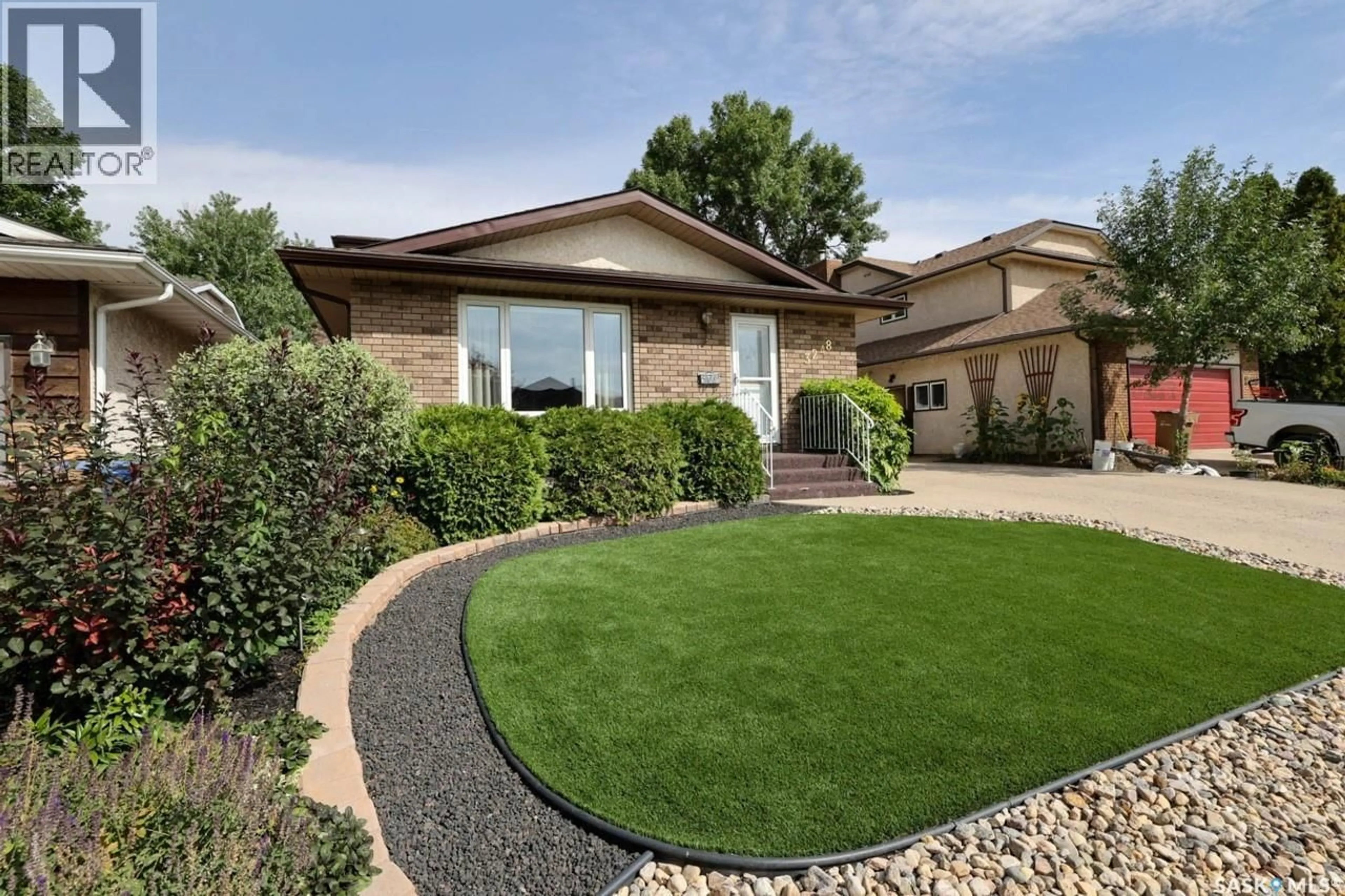 Home with brick exterior material, street for 3248 MACLACHLAN CRESCENT, Regina Saskatchewan S4R8H5