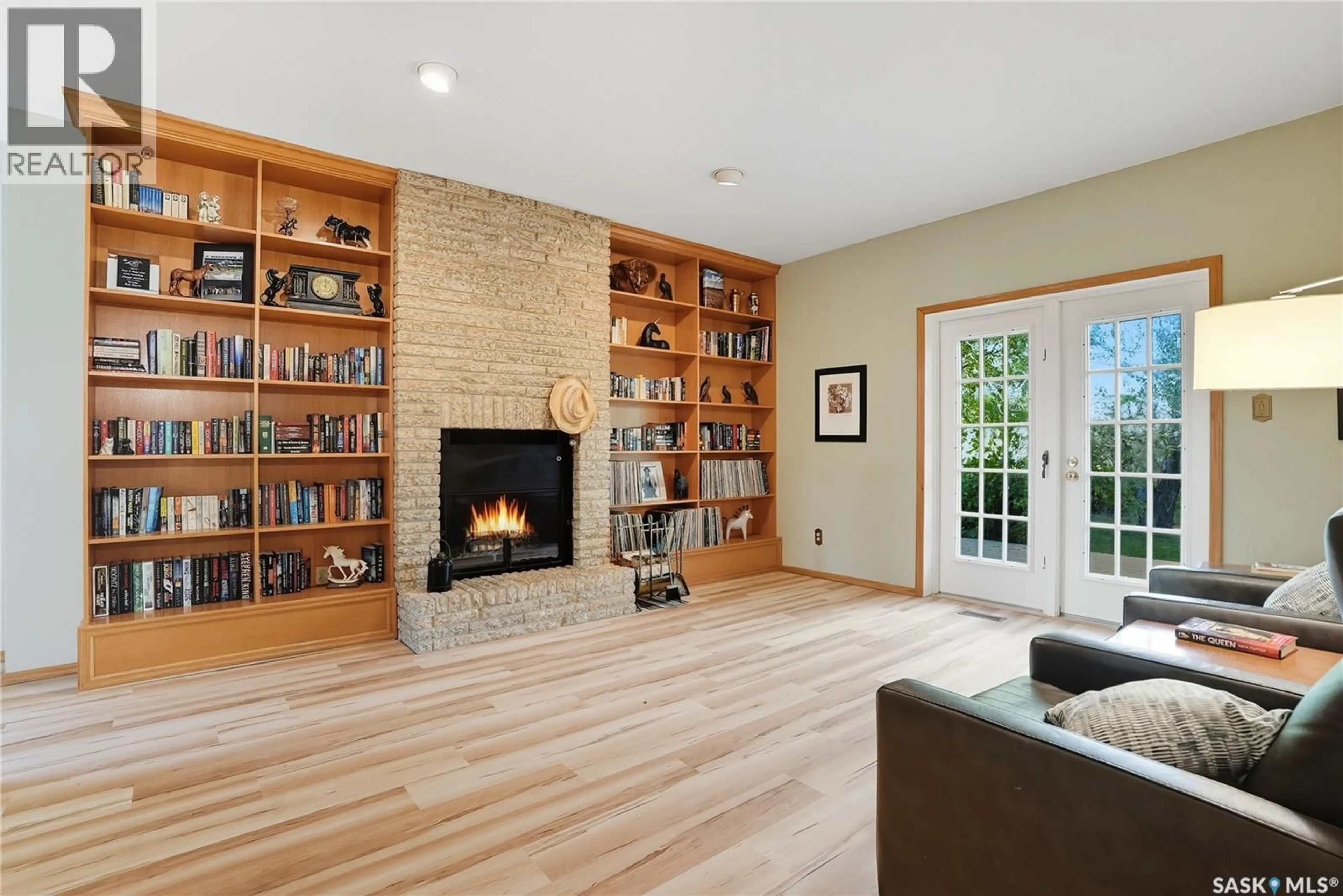 Living room with furniture, wood/laminate floor for Saskatoon - 80 ACRES NW, Corman Park Rm No. 344 Saskatchewan S7K5W1