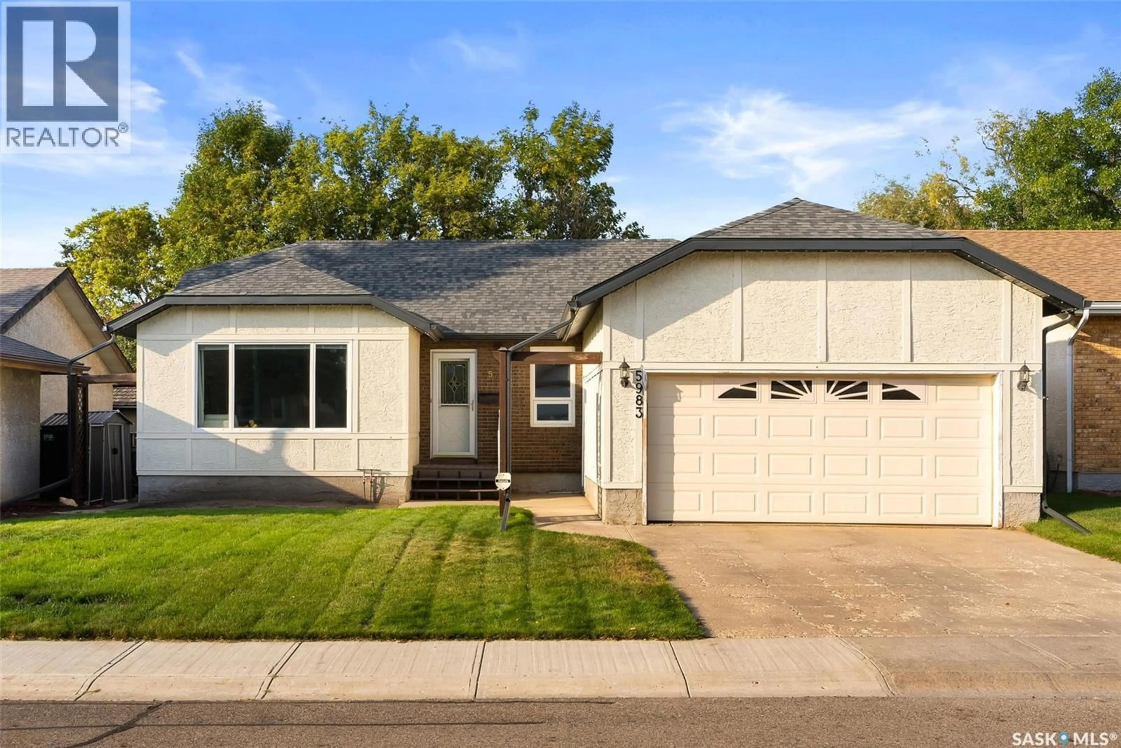 Home with vinyl exterior material, street for 5983 STEELE CRESCENT, Regina Saskatchewan S4X4B1