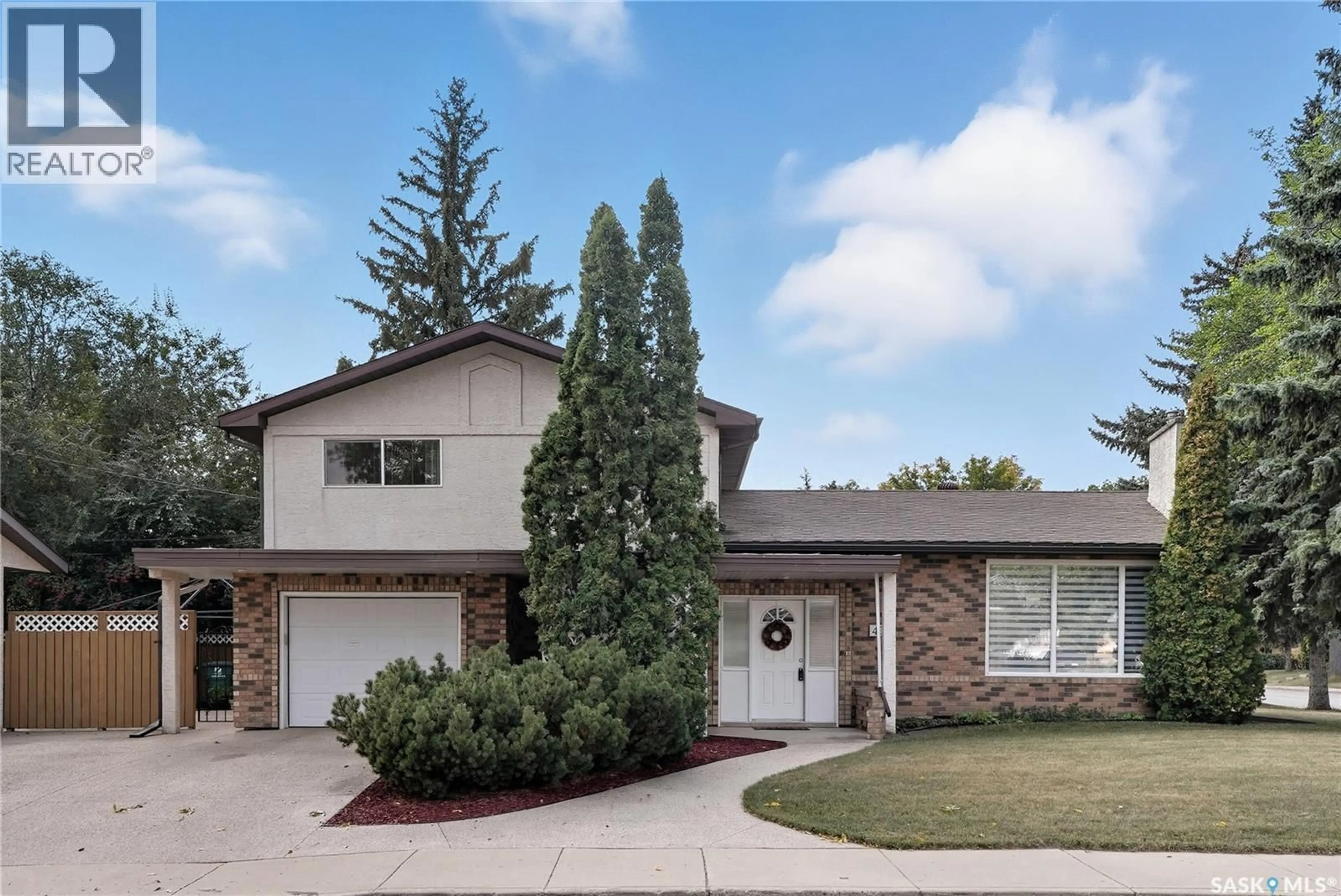 Home with brick exterior material, street for 402 WITNEY AVENUE, Saskatoon Saskatchewan S7L3M7