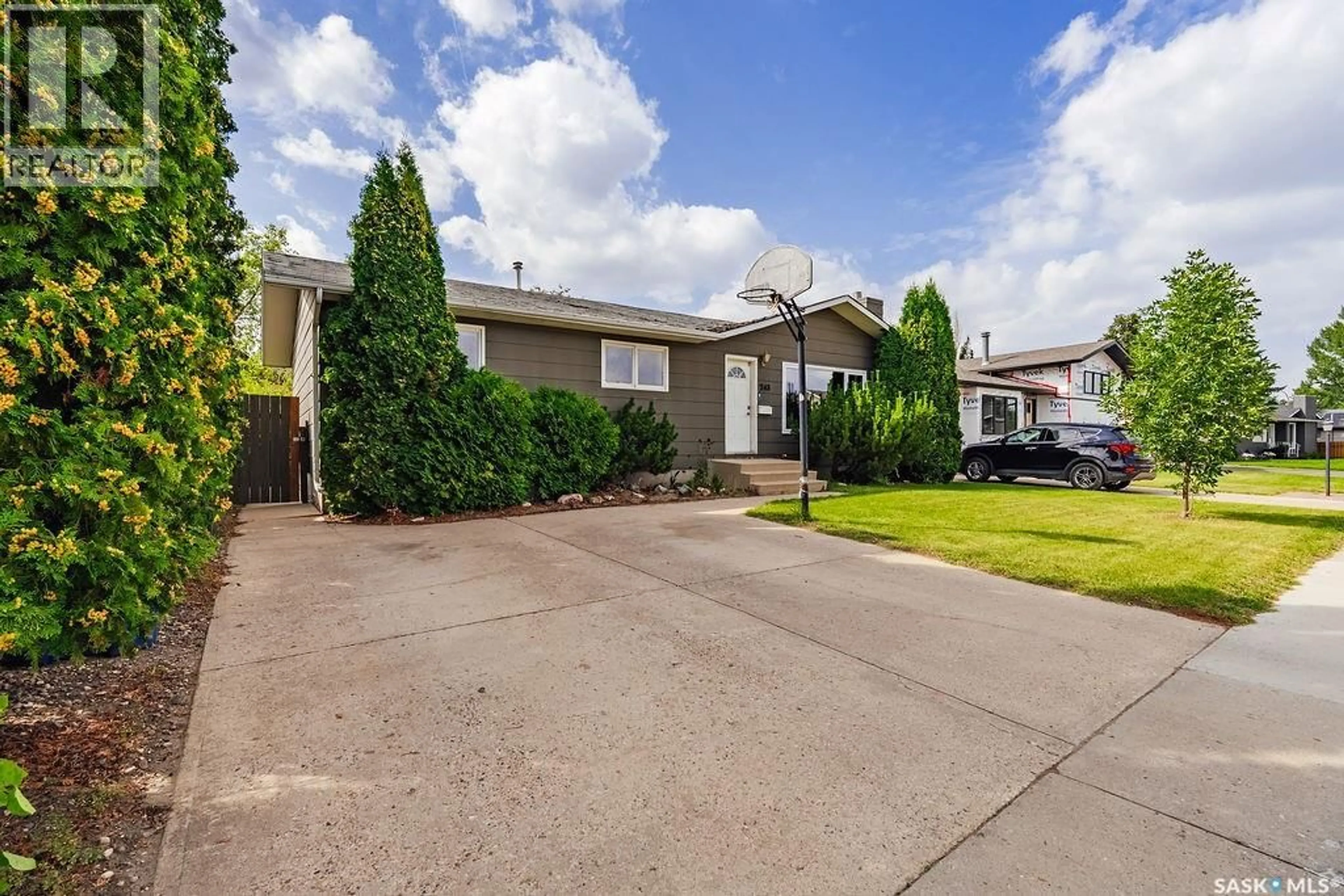 Home with vinyl exterior material, street for 243 ROBORECKI CRESCENT, Saskatoon Saskatchewan S7K5L1